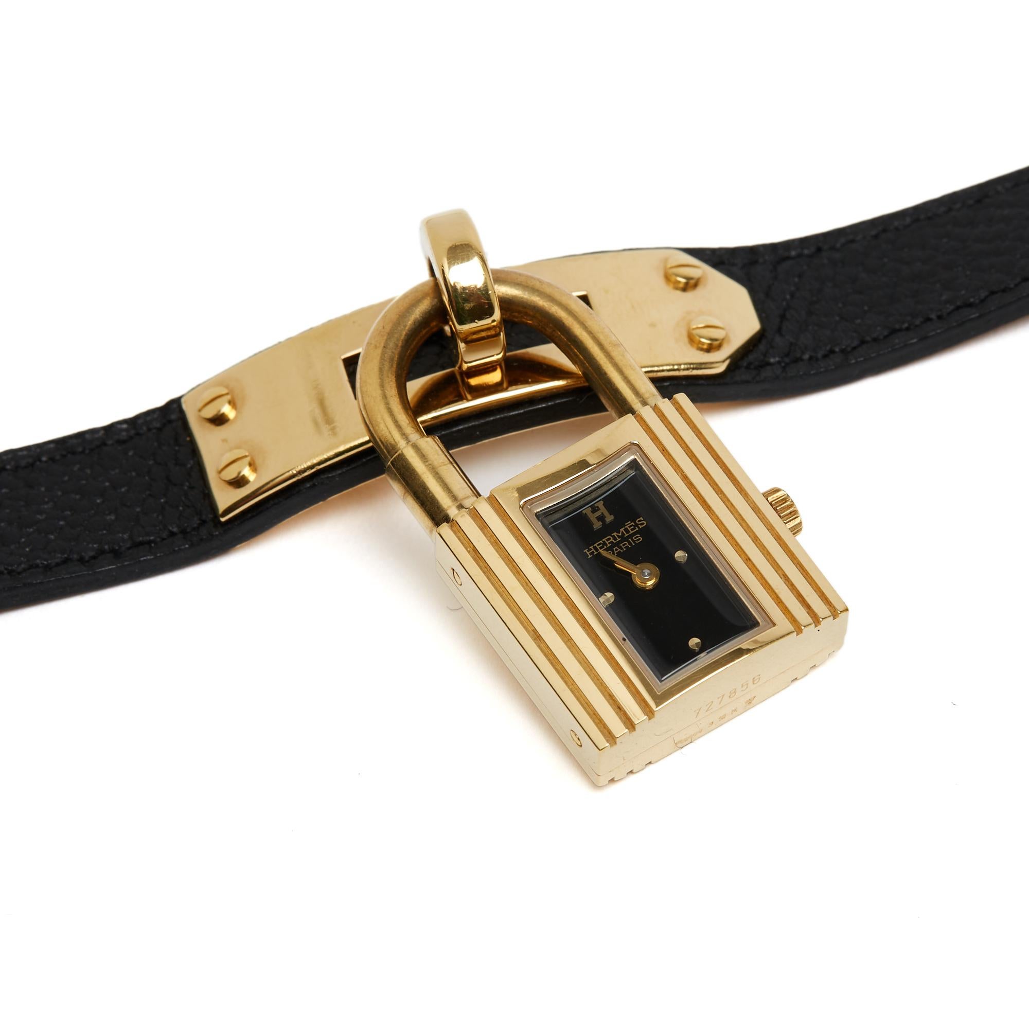 Orologio Hermès Kelly in pelle nera dorata in vendita 1