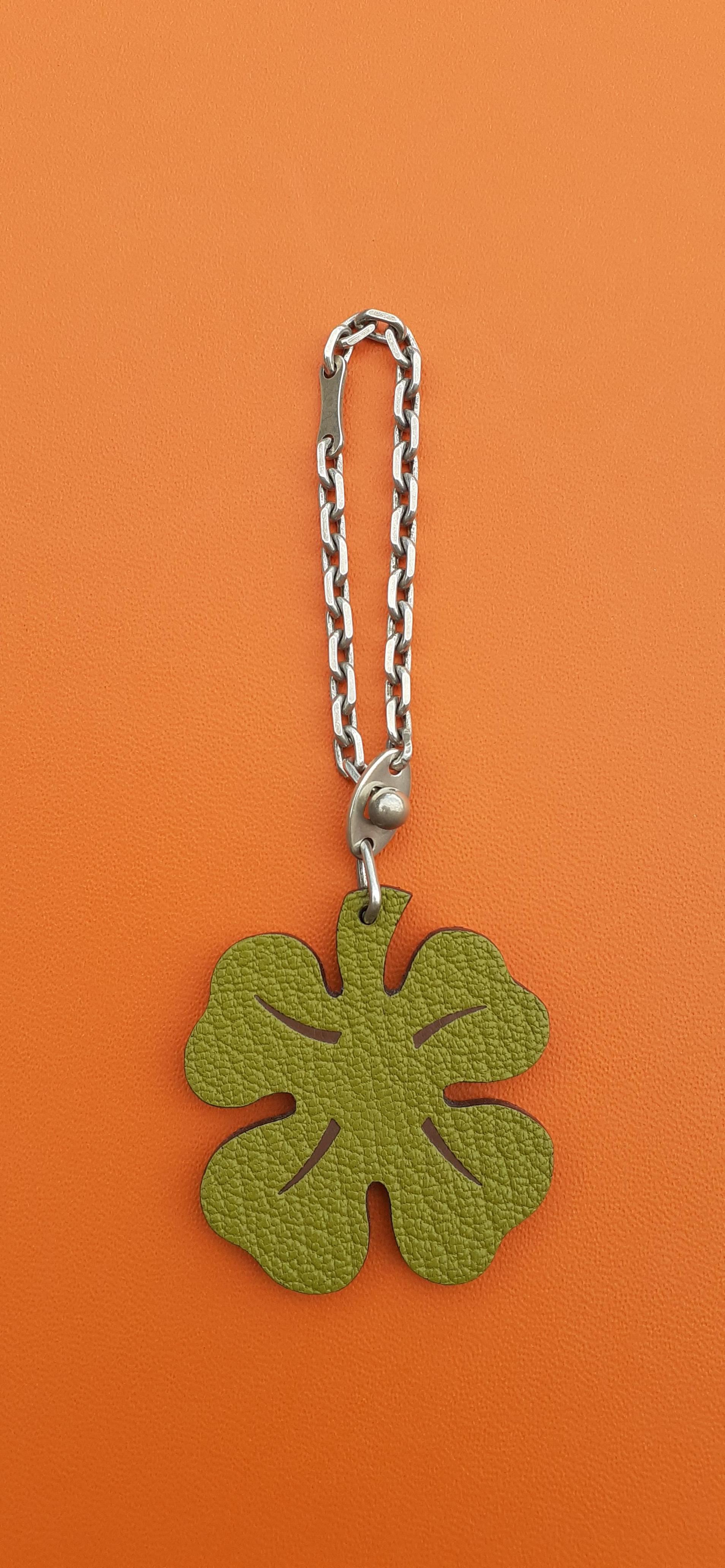 Super Cute Authentic Hermès Key Holder

Can be used as Bag Charm for your Kelly, Birkin or other Hermès Bag, or as keychain

Pattern: 4-leaf Clover

Made in France

Made of Grained Leather

Colorway: 1 side Green and Brown, Other side Plain