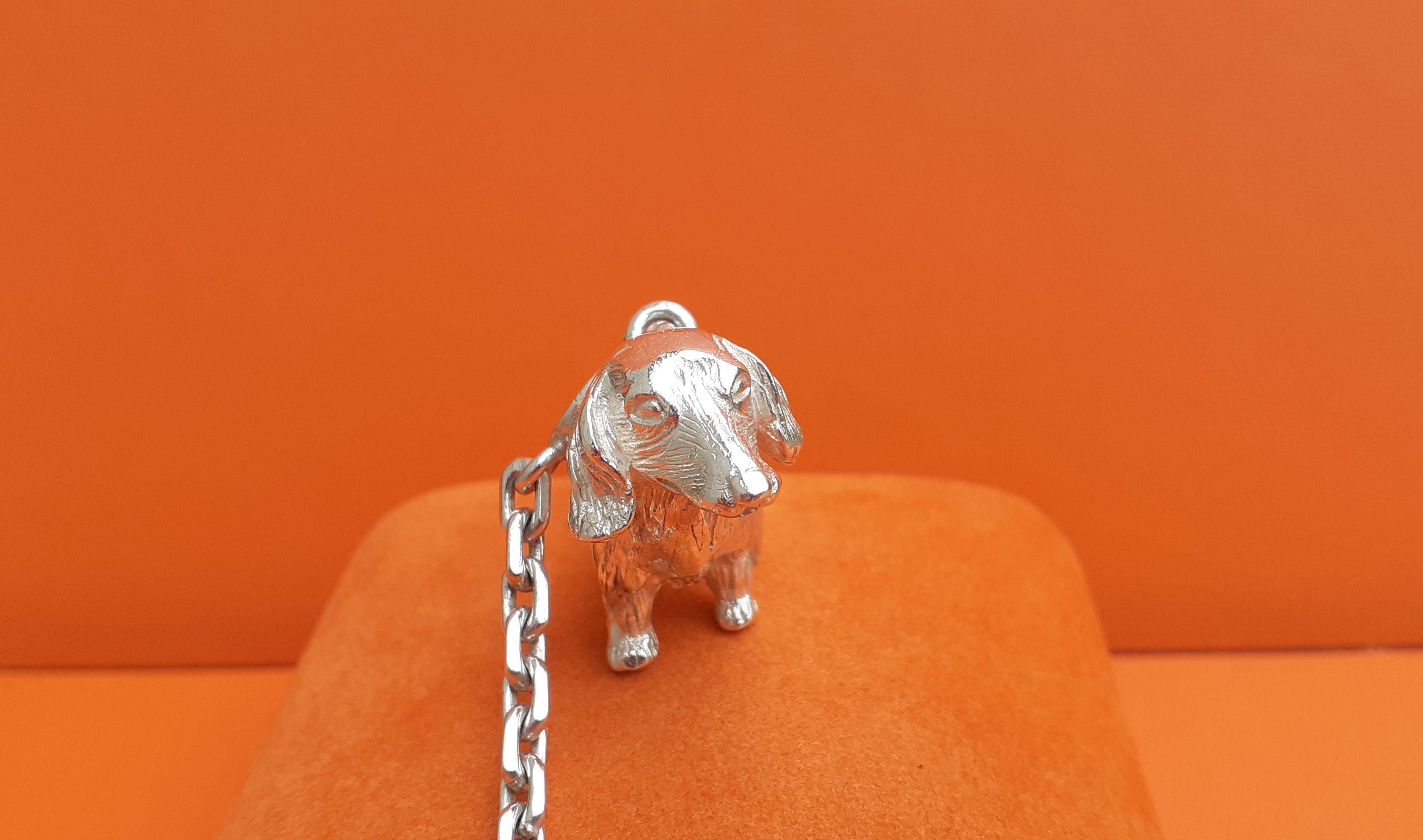 Extremely Rare and Cute Authentic Hermès Key Holder

In shape of a dachshund dog

Vintage item

Made in France (engraved on the edge of the main ring)

Made of silver

Colorway: silvery


