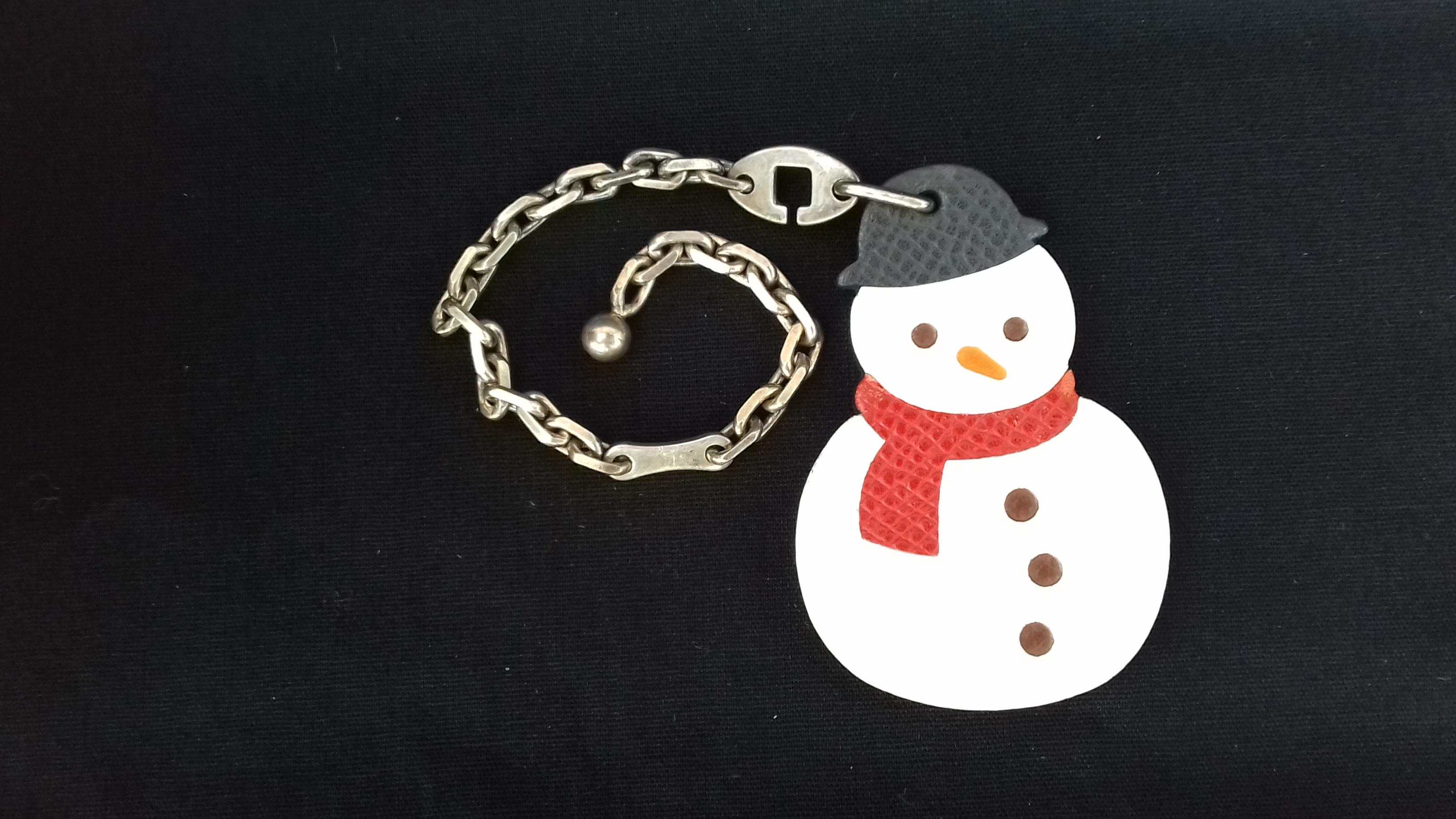 Super Cute Authentic Hermès Key Holder

Can be used as Bag Charm for your Kelly or Birkin bag

Pattern: Snowman

Perfect for winter and Christmas Season

Made of Courchevel Leather and Silver-Tone Metal Chain

Colorways: White, Red, Orange,