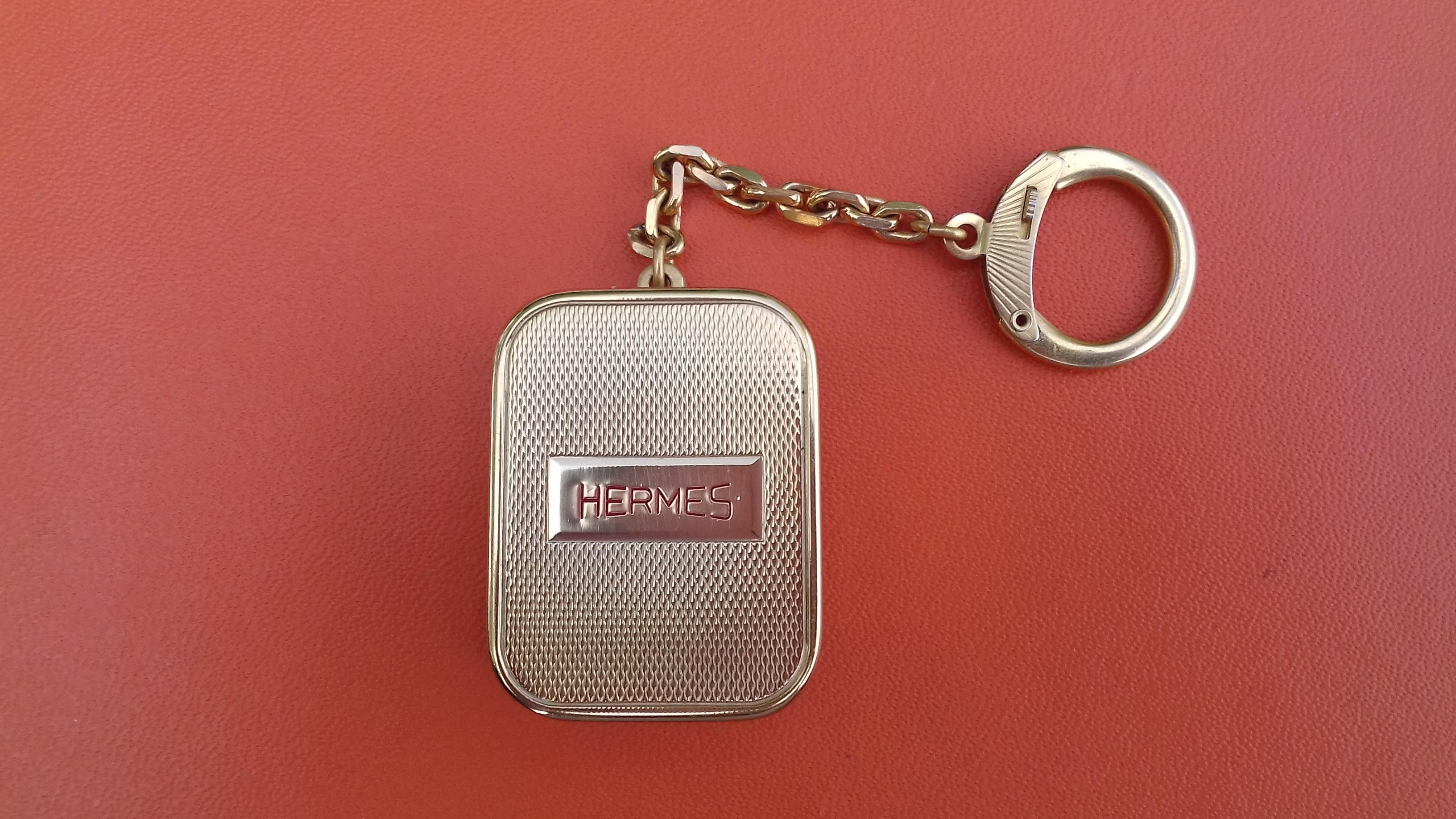 Rare Authentic Hermès Keychain

It is also a music box ! Please ask for a video if you want to hear the music

Turn the mechanical key (at the back) clockwise and pull up the small button to hear the music 

Made by Reuge Sainte Croix, specialist