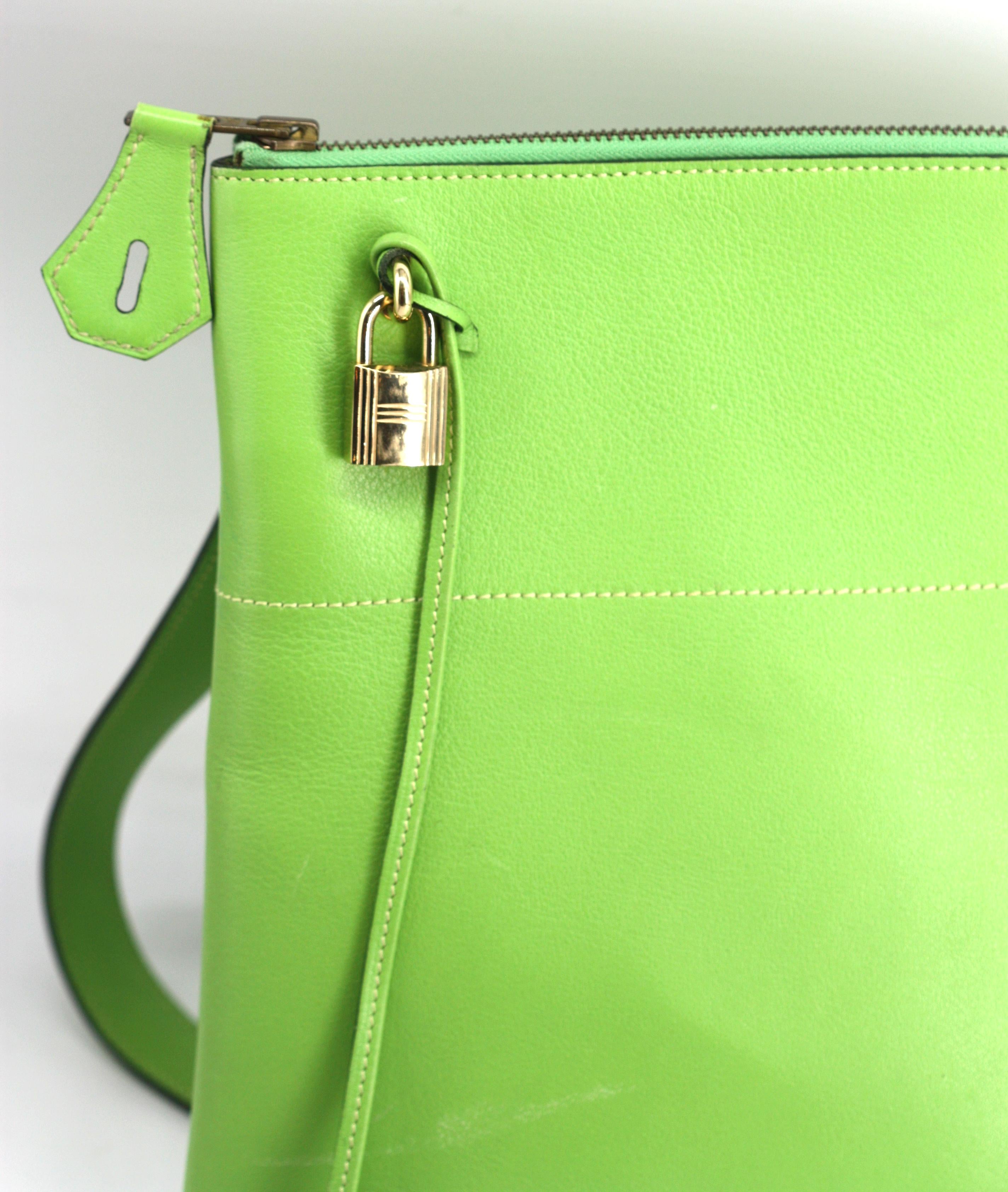
Hermes Kiwi Green Calfs Leather Shoulder Bag
The leather stamped Hermes Paris Made in France, the inside zipper impressed Hermes, the exterior zipper marked Eclair, the lock and keys marked Hermes 104. Oval shaped bottom, one upper corned rounded