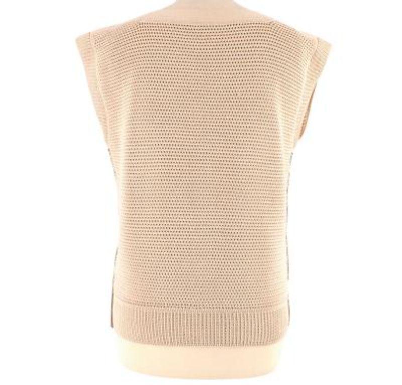 Hermes Knitted Vest

-Leather trimmed 
-Square neckline 
-Knitted boty 
-Ribbed trims 
-Box body shape 
-Sleeveless 

Material:

100% Cotton 

PLEASE NOTE, THESE ITEMS ARE PRE-OWNED AND MAY SHOW SIGNS OF BEING STORED EVEN WHEN UNWORN AND UNUSED.