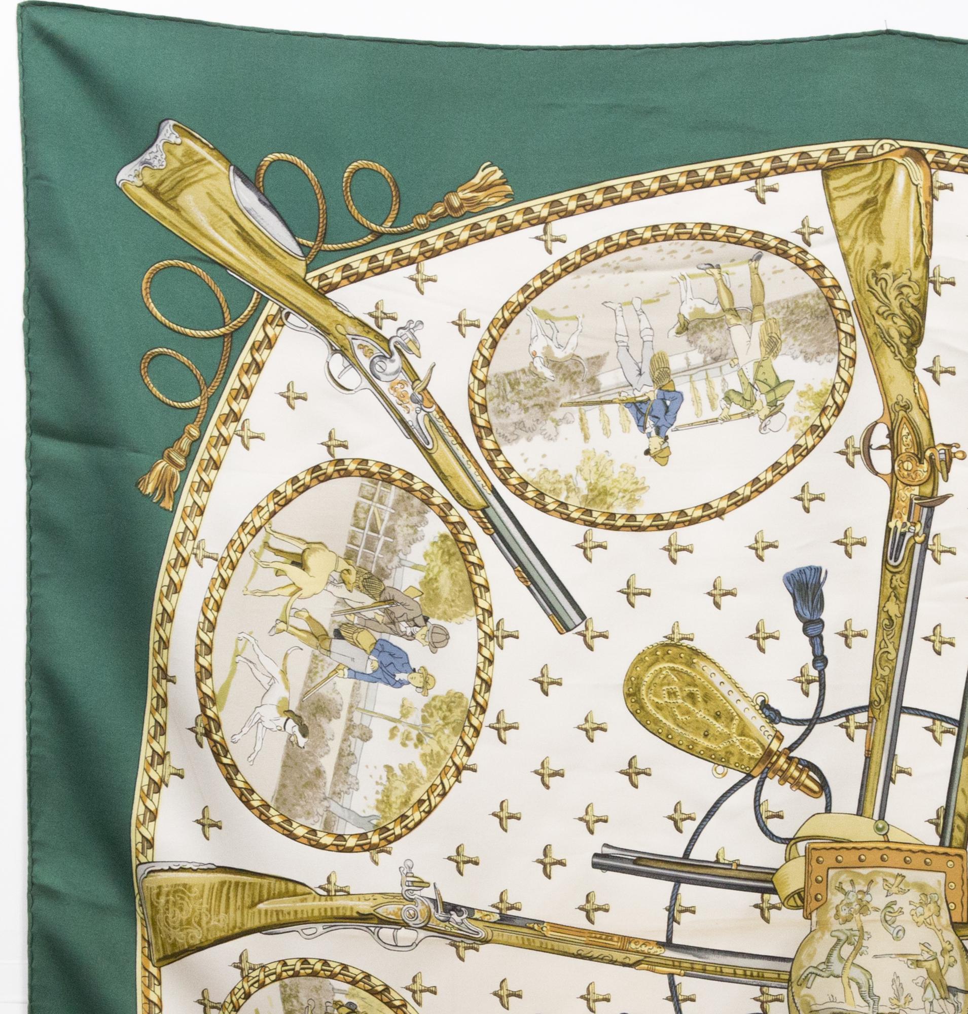Hermès “La Chasse A Tir” by Philippe Ledoux silk scarf featuring a green border, a Hermès signature. 
Circa 1972
In good vintage condition. Made in France.
35,4in. (90cm)  X 35,4in. (90cm)
We guarantee you will receive this  iconic item as described