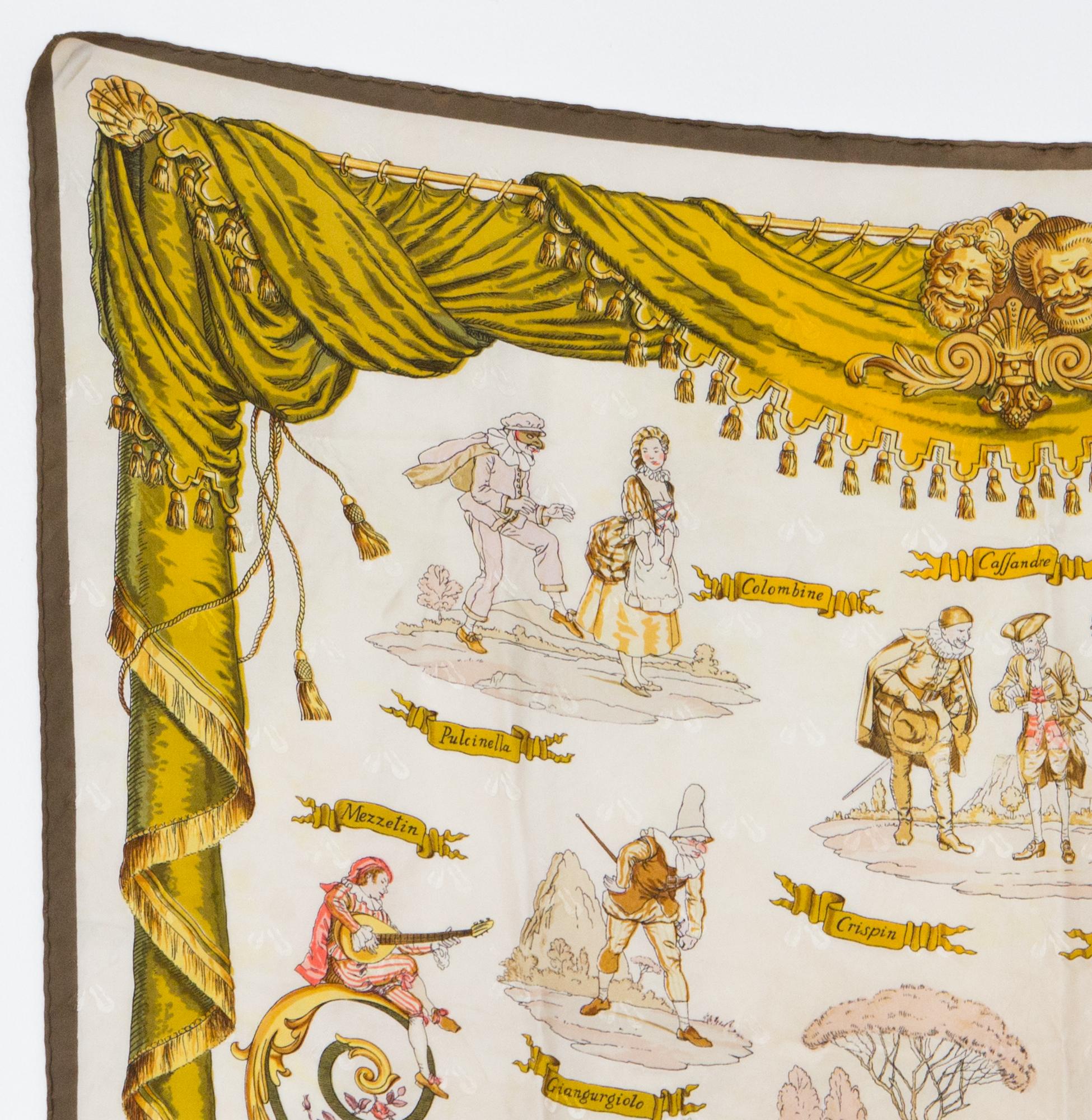 1960s Hermes silk scarf La Comédie Italienne by Philippe Ledoux (1st edition 1962) featuring a ochre border.  
In good vintage condition. Made in France.
35,4in. (90cm) X 35,4in. (90cm)
We guarantee you will receive this  iconic item as described