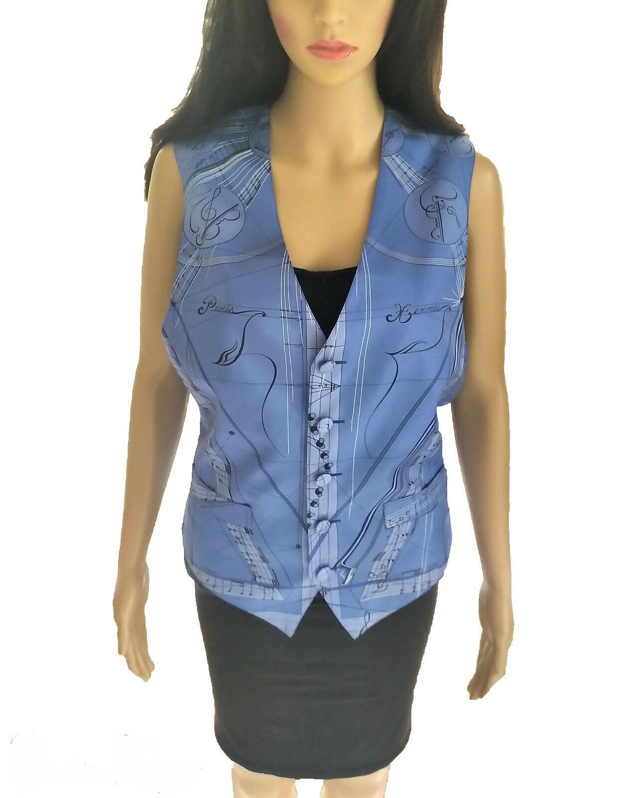 Lovely, Hermès La Musique D' Hermes French blue 100% silk scarf print vest in size FR 38/ US 6. Extremely rare vest, circa late 1990's. This piece is a true work of art. It is so rich & decadent, with great aesthetic beauty. A lovely tribute to