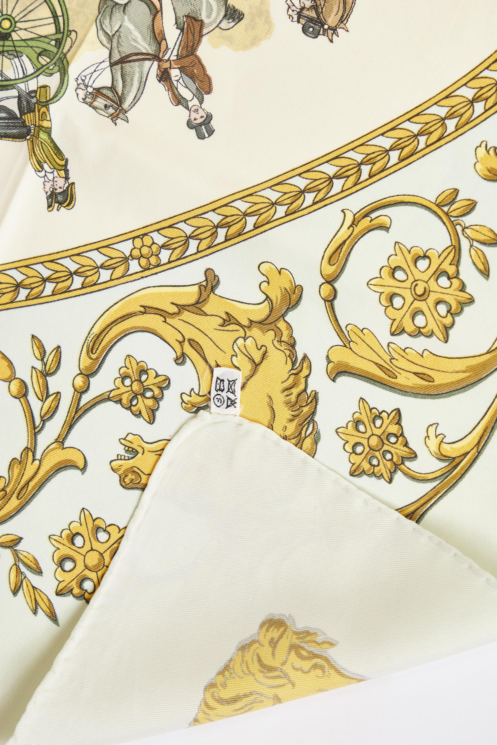 Hermès silk twill La Promenade de Longchamps scarf by coveted artist Ledoux. Original issue date 1965. Depicts carriage horses and ornate gold scrolling. Hand-rolled edges. Does not include box. Minor wear.
