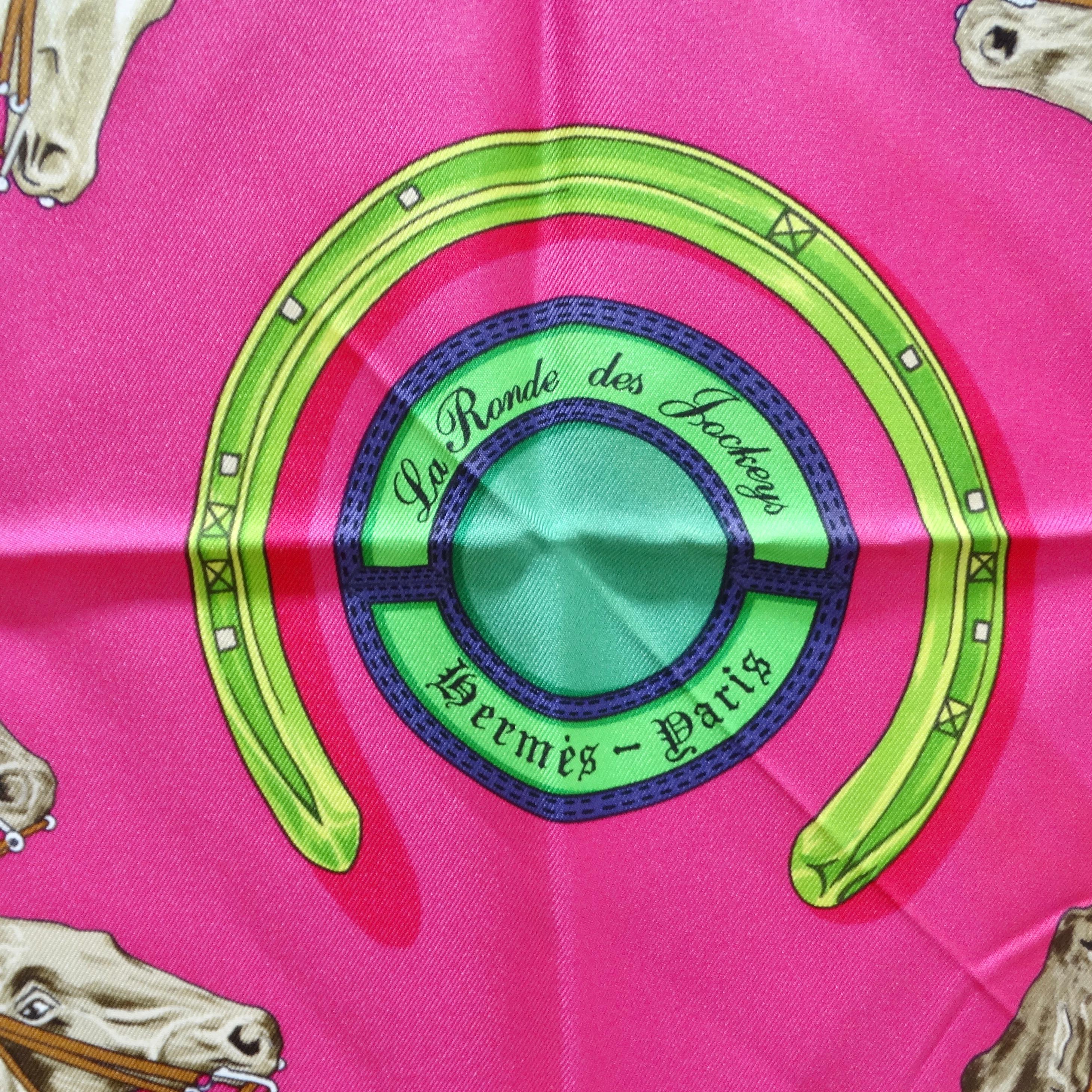 Do not miss out on the Hermès La Ronde Des Jockeys Silk Scarf, a wearable work of art that brings vibrant energy and elegance to your ensemble. This hot pink silk scarf, adorned with a vibrant green border, features an intricate print depicting men