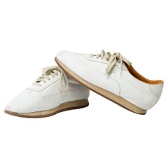 Hermès Lace-Up Sneakers in white calfskin leather