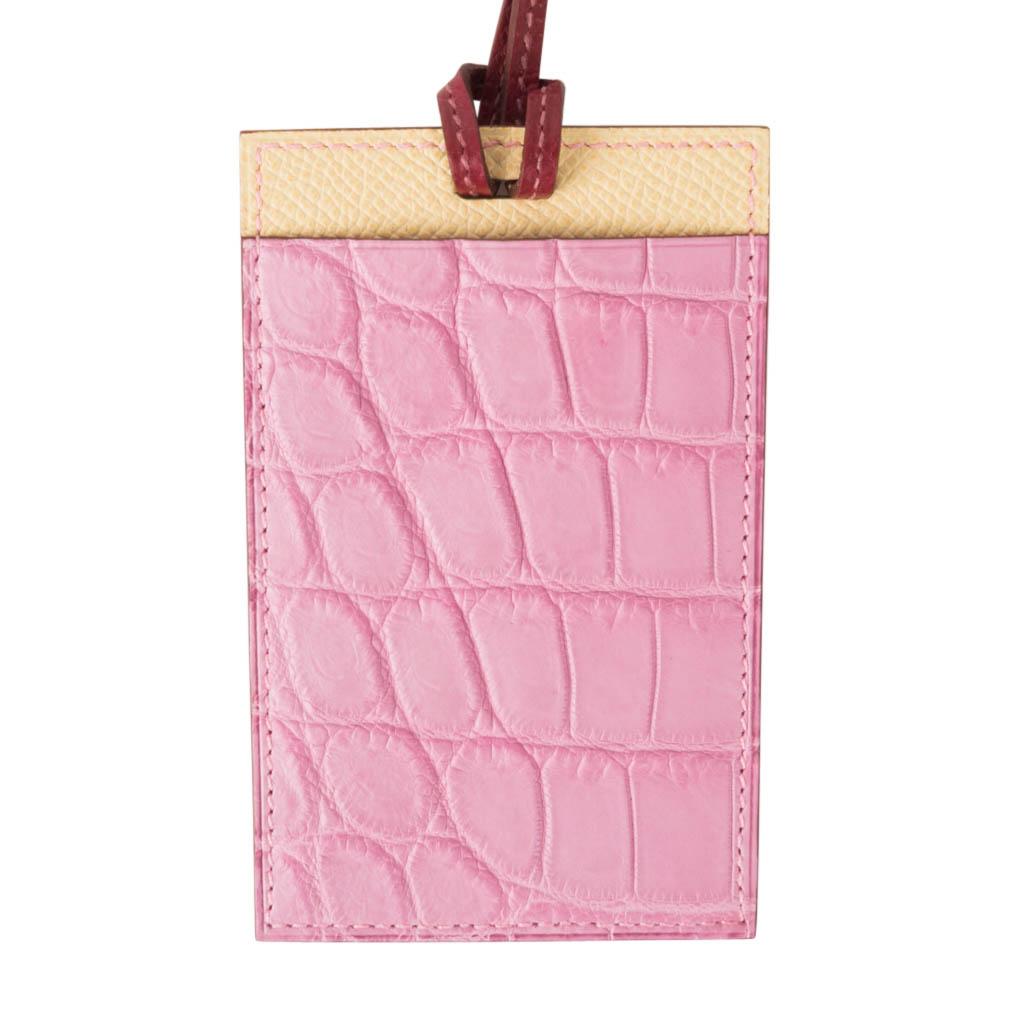 Guaranteed authentic Hermes Petite h Lanyard card holder.
5P Pink Porosus Crocodile and Jaune Epsom leather with an orange interior.
Cardholder has a slot on each side and a thin rouge leather strap.
Comes with signature Hermes box and Cites.
New or
