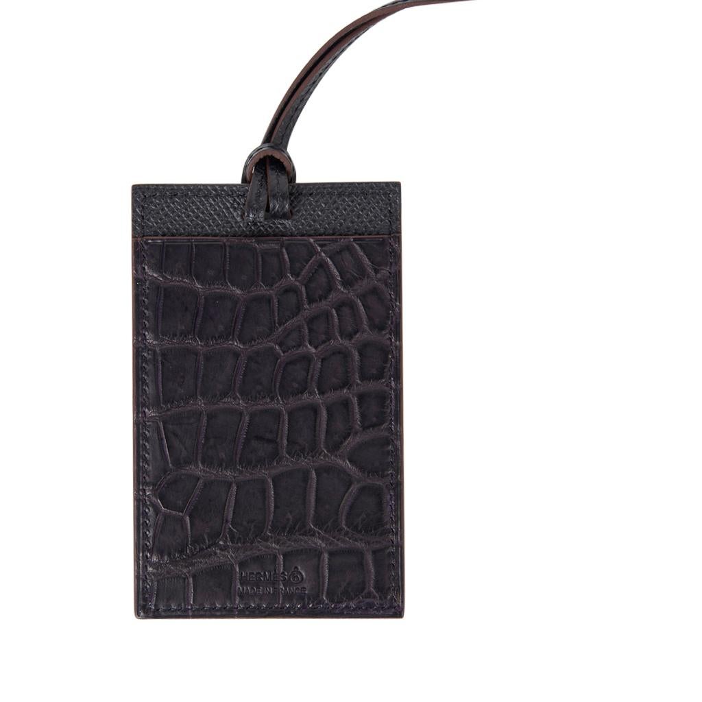 Guaranteed authentic Hermes Petite h Lanyard card holder.
Prunior Matte Crocodile and Bleu Vert in Epsom leather.
Card holder has a slot on each side and a thin Black Epsom leather strap.
Comes with box and Cites.
New or Never Worn.
final