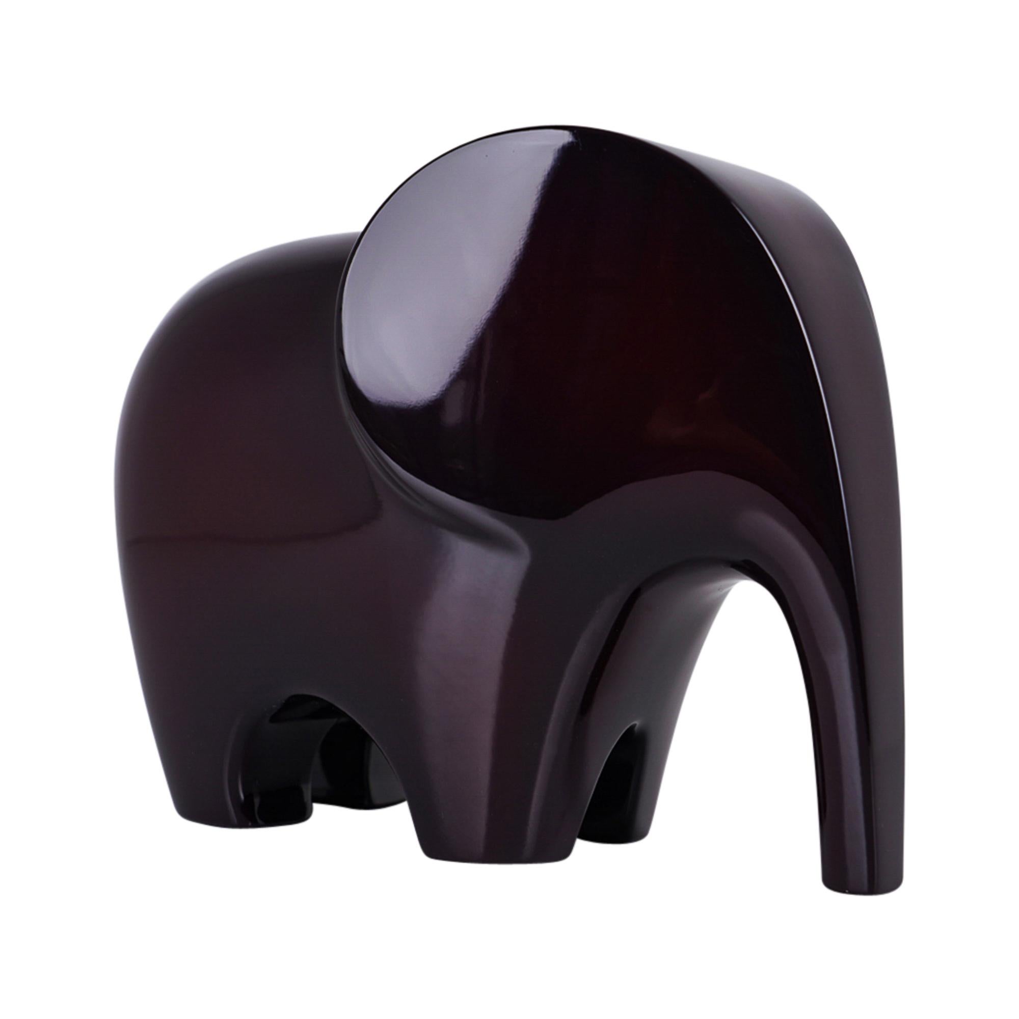 Mightychic offers a guaranteed authentic Hermes Lao Elephant paperweight featured in Aubergine hand lacquered wood.
Sold out and very difficult to find new.
A perfect accent piece for any room.
Wonderful for desk or gifting.
Accompanied with