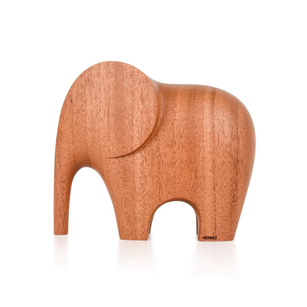 Guaranteed authentic Hermes charming Lao Elephant paperweight featured in natural mahogany.
Sold out and very difficult to find new.
A perfect accent piece for any room.
Wonderful for desk or gifting.
Accompanied with signature Hermes box and