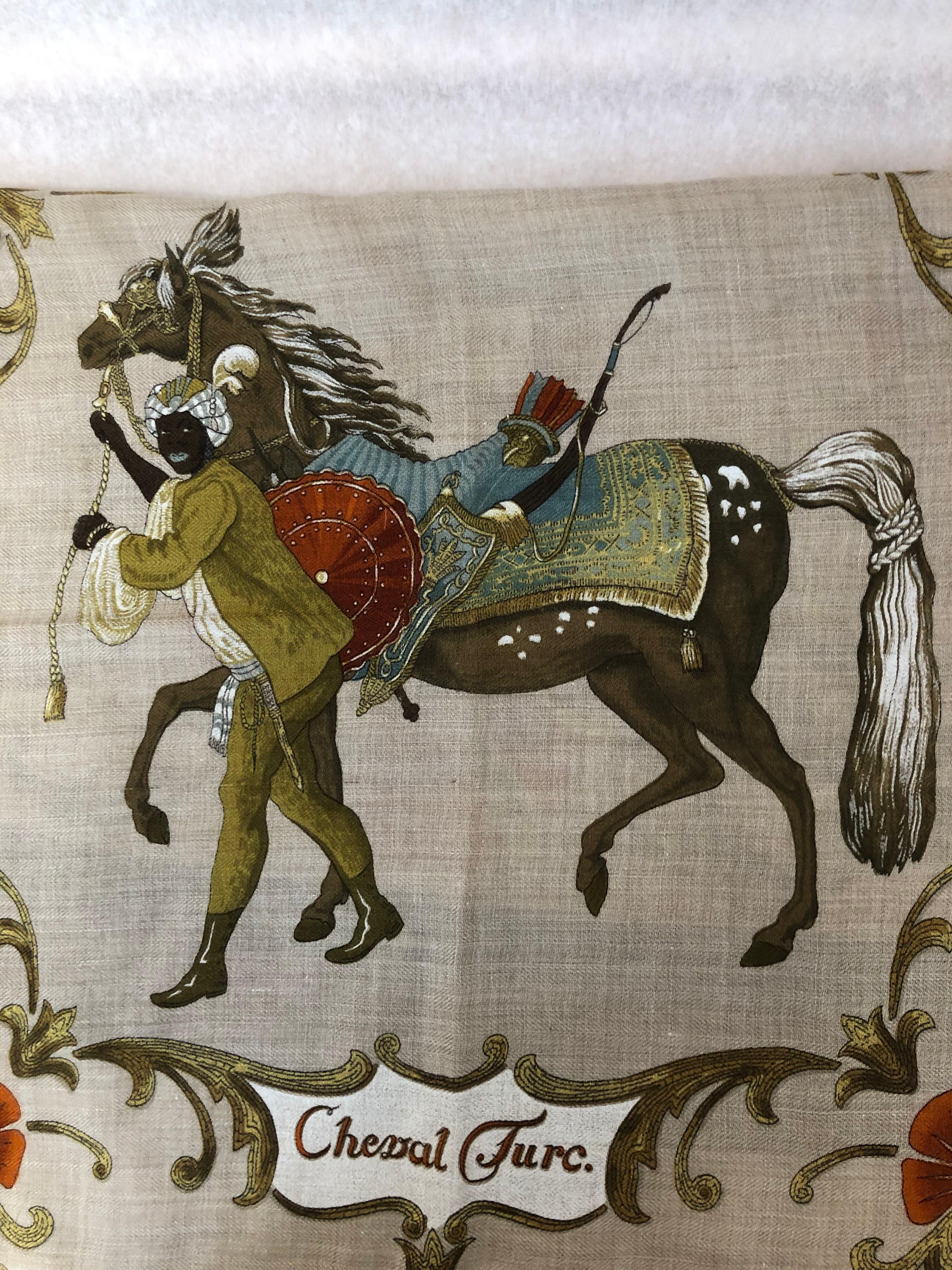 This Hermes cashmere 65% and silk 35% scarf was designed by Christiane Vauzelles in 1969. It is in very good condition except for a small pull. The care tag is intact and the hand rolled hems nice and plump.

Fantastic graphics of horse and rider.