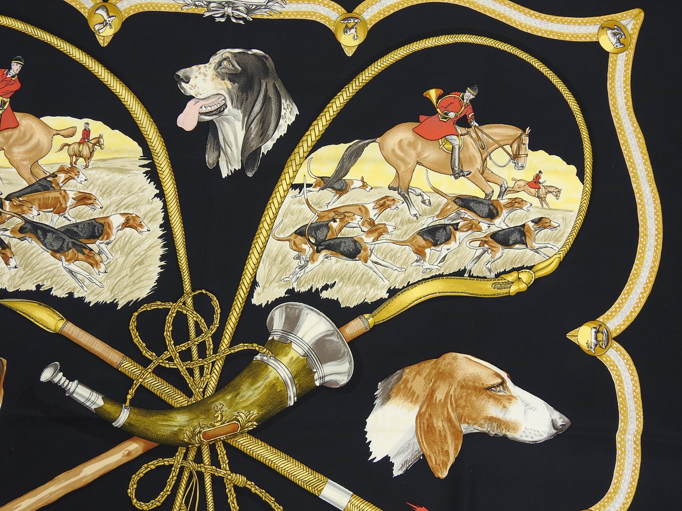 Hermes Le Laisser Courre Black Hunting Dogs 90cm Silk Scarf.  Design features hunting scenes and hound dogs in black, yellow, and red colors. Excellent pre-owned condition.  Includes box.
