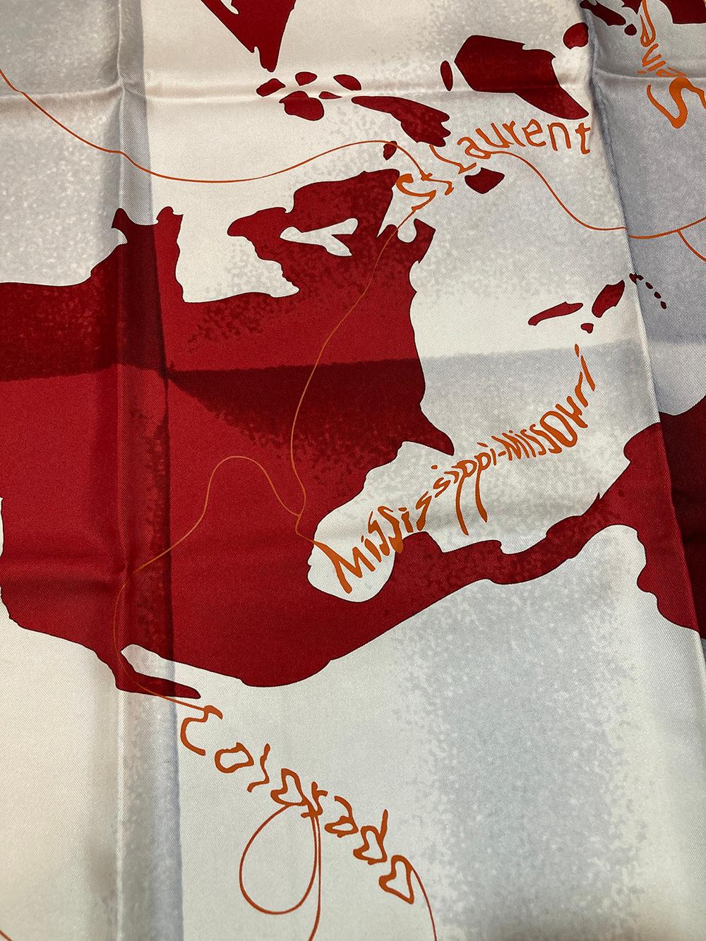 Hermes Le Monde est une Fleuve World Print Silk Scarf in Red in excellent condition. Original silk screen design c2005 by Bali Barret features a unique world map print with all the global continents in red over a gray and white background with thin