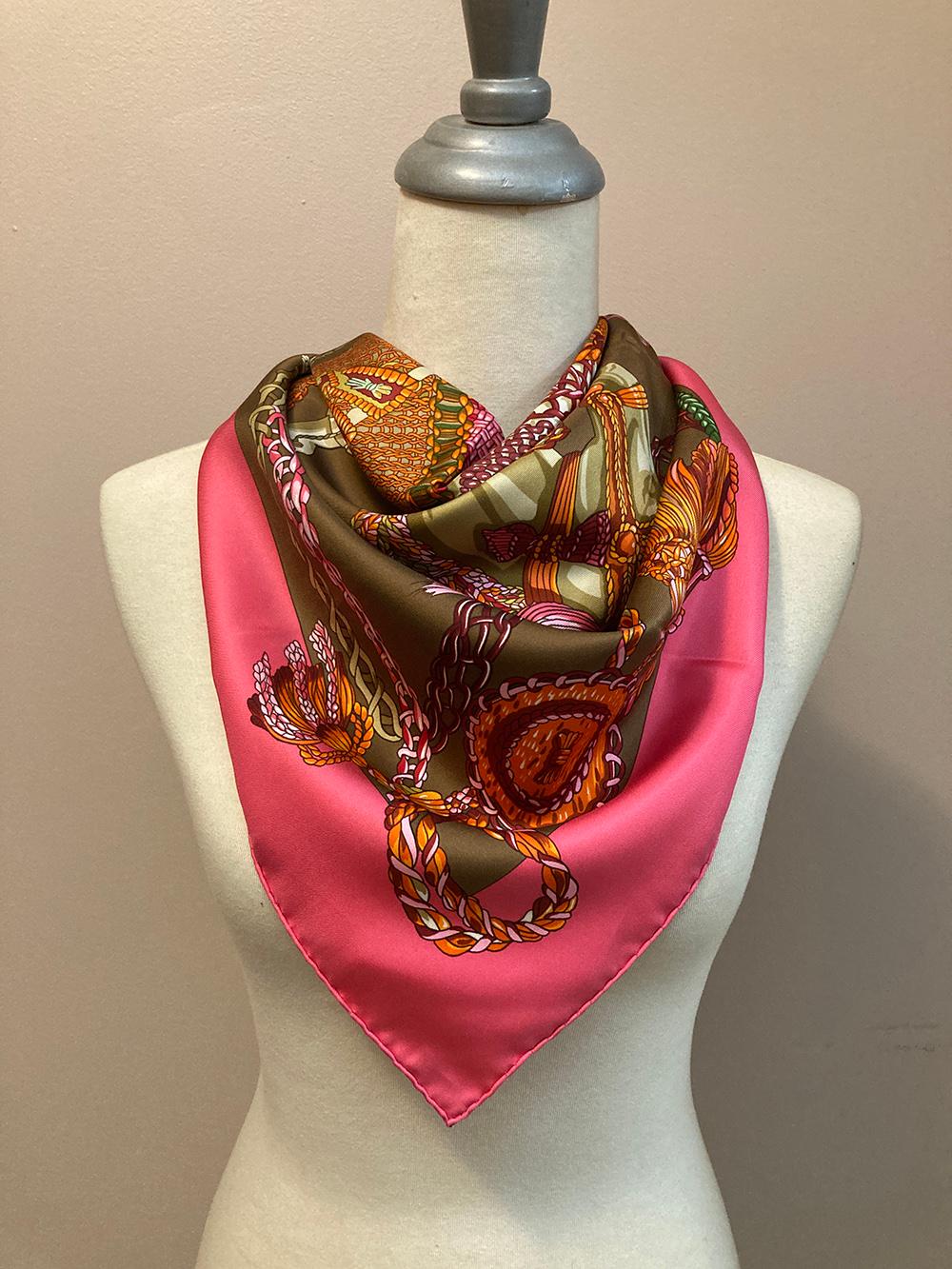 Hermes Le Timbalier Silk Scarf in Pink and Brown c1960s in excellent condition. Original silk screen design c1961 by Françoise Heron features an extravagant horse and rider with colorful braided tassels, ribbons, ropes, dress and garb in green,