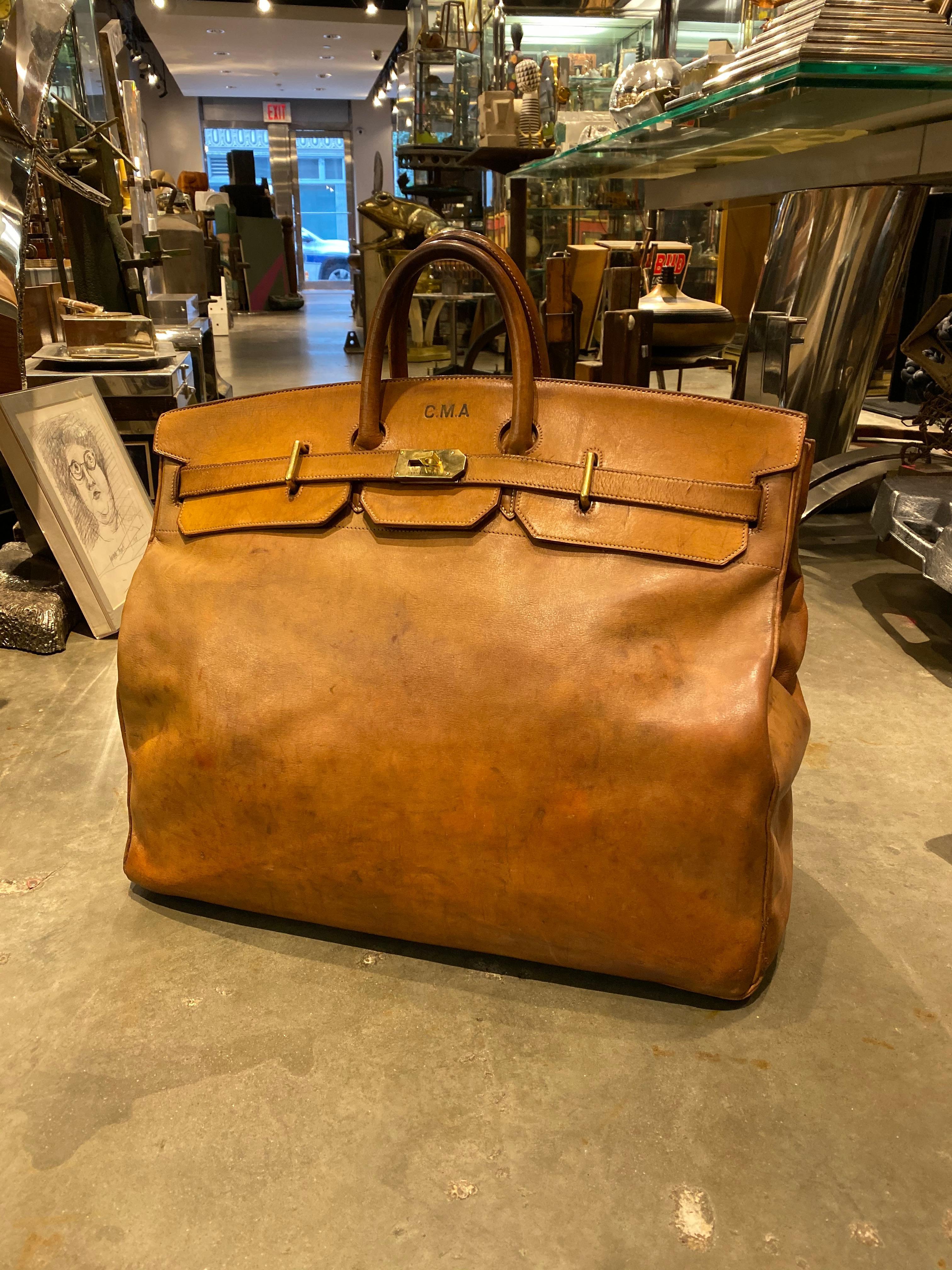 For your consideration is one of the most rare, and spectacular bags we have ever come across. This bag is in incredible structural condition, with many years of life left it. From the handles to the body, this bag has developed a perfect patina. At