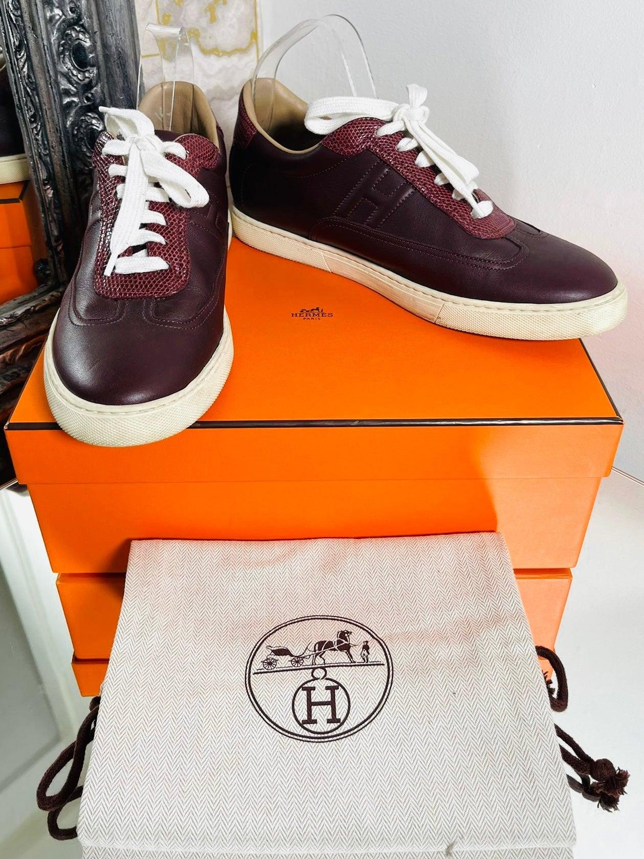 Hermes Leather & Lizard Skin 'H' Sneakers

Burgundy trainers with the 'H' to all sides inner and outer. Leather with Lizard skin accents to the fronts and heels.

Additional information:
Size – 40
Composition- Leather, Lizard Skin 
Condition – Very