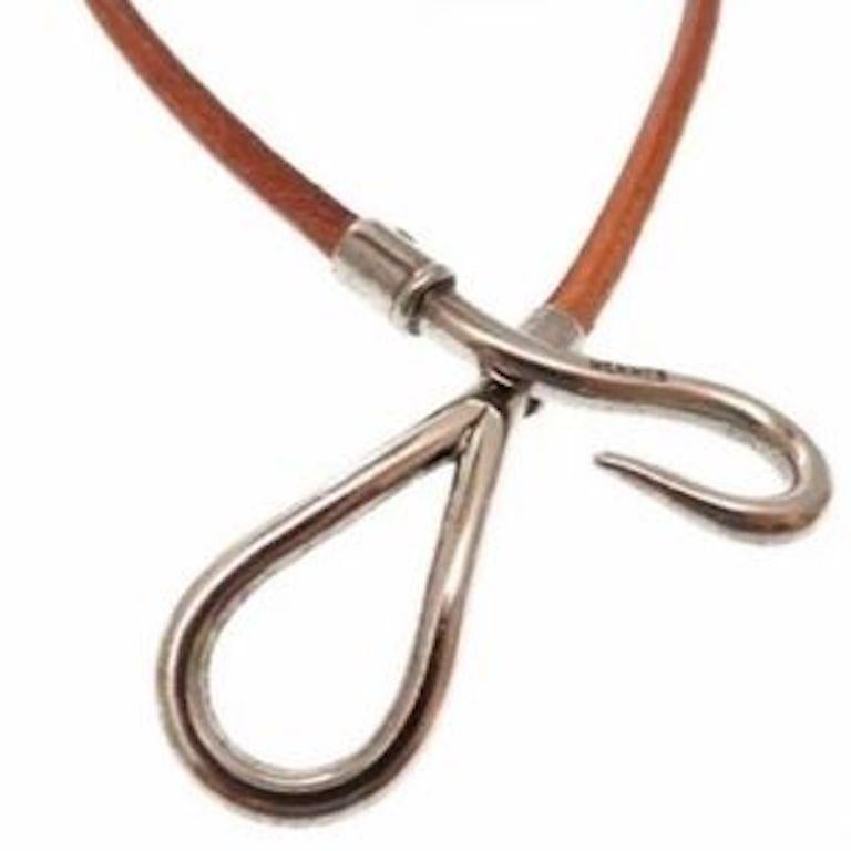 Hermes Jumbo Hook chocker necklace in cognac color leather cord with Palladium hardware. The Jumbo hook is inscribed Hermes. End to end the necklace measures 15 inches long. The eye end of the necklace is .69 on an inch wide. Very nice condition.