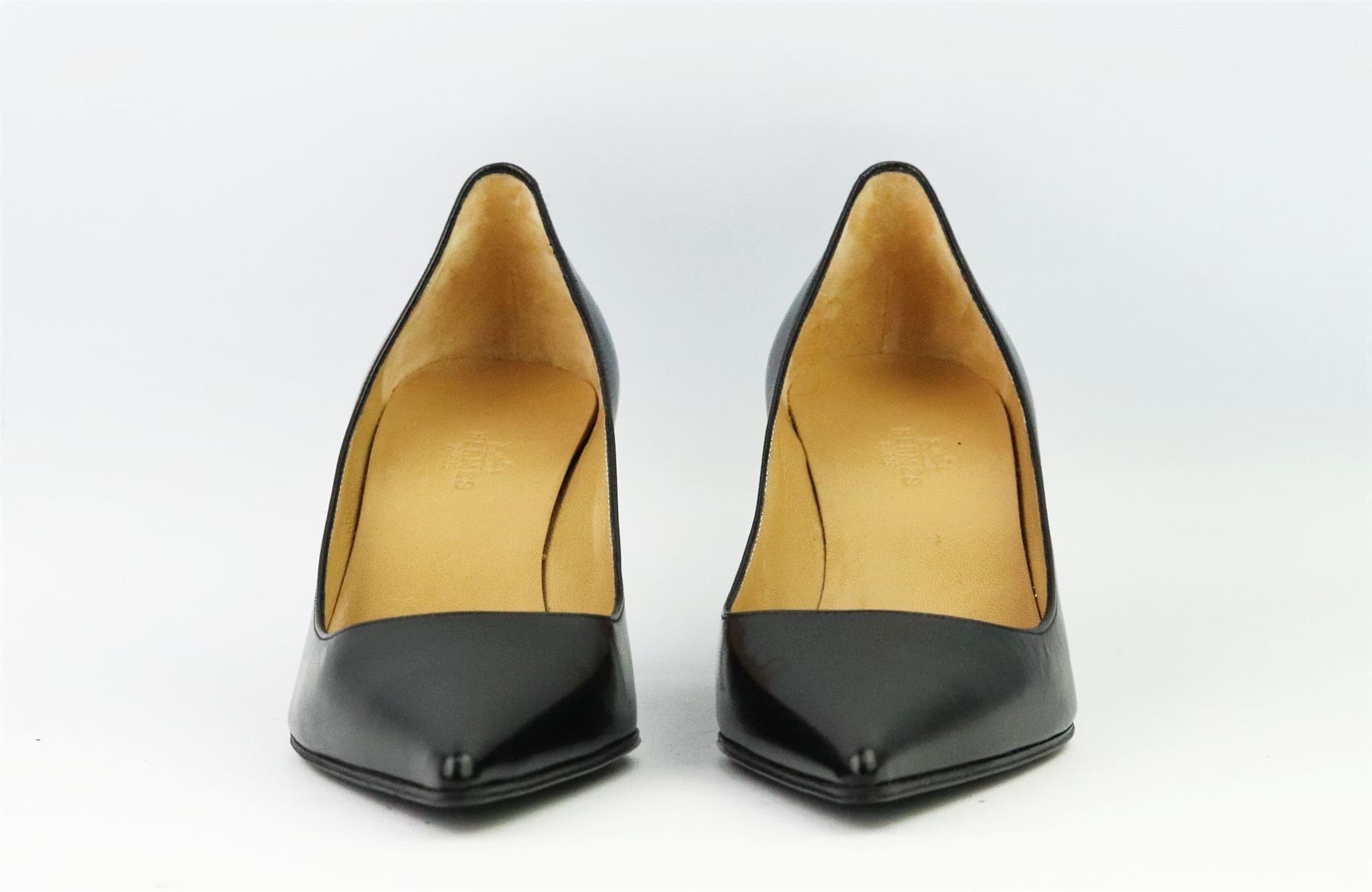 These pumps by Hermès are a classic style that will never date, made in Italy from supple black leather, they have sharp pointed toes and comfortable 63mm heels to take you from morning meetings to dinner with friends. Heel measures approximately 63