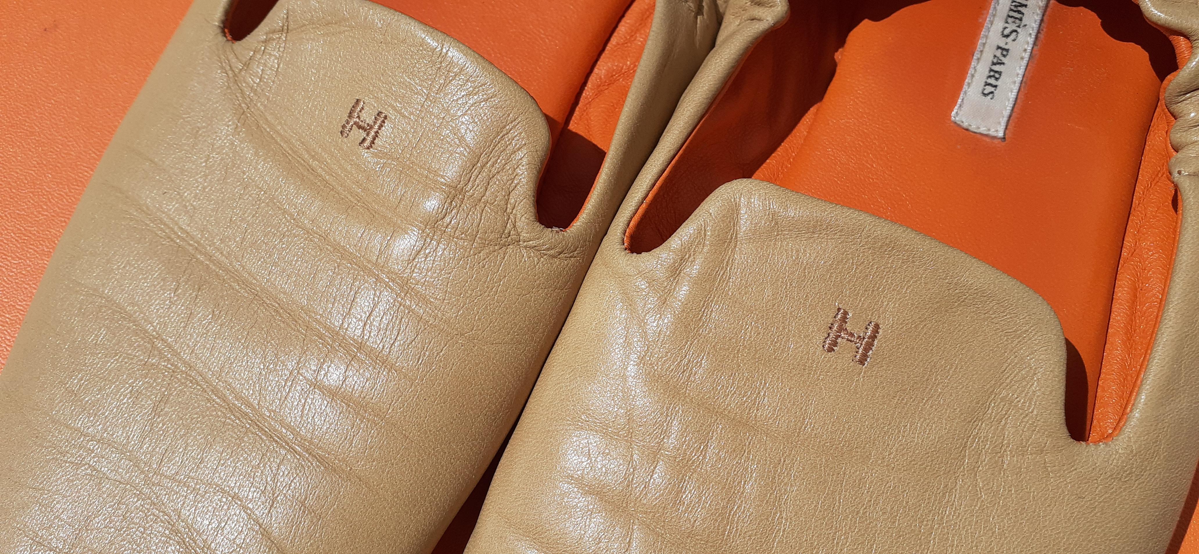 Beautiful Hermès Slippers

Super comfortable

Made of Lambskin Smooth Leather and Suede Outsole

Inside is lined with orange smooth Leather

The back of the slippers is elasticated providing a perfect support

Made in Spain

