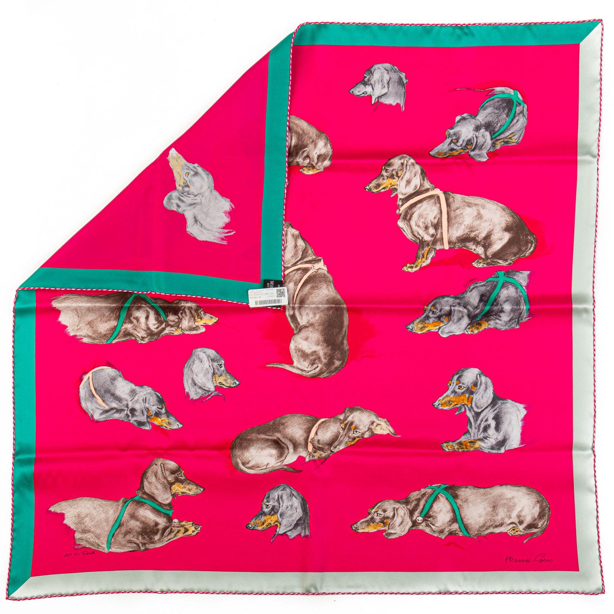 Hermès rare and collectible Les Bassets Alemands silk scarf. Hand rolled edges. Comes with original box.