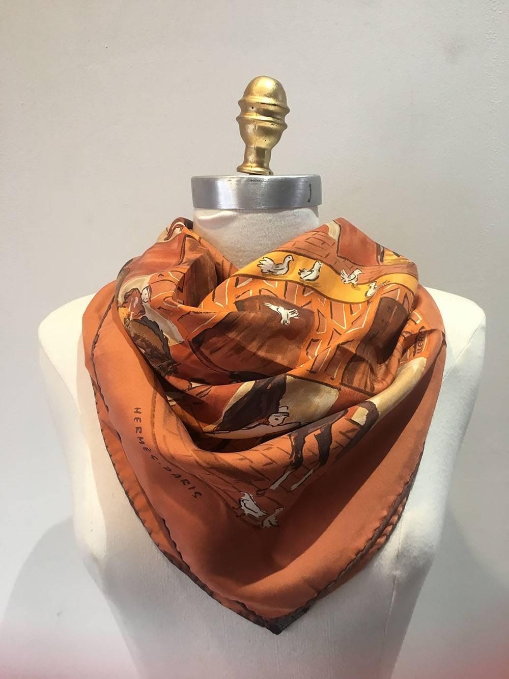 Classic Hermes Les Boxes silk scarf in very good condition.  Original silk screen design c2006 by Jean-Louis Clerc features an array of horses and box stables in rows over a rust colored background.  100% silk, hand rolled hem. Made in France. Tag