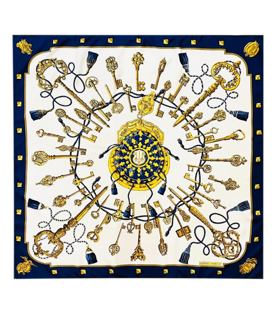 Hermes Les Cles The Keys Silk Scarf

White scarf designed by Cathy Latham, detailed keys and tassels print in gold and navy.

Featuring navy trim, hand-rolled hem and 'Hermes Paris' inscription. Rrp £415

Size – 88cm x 88cm

Condition – Good (Some