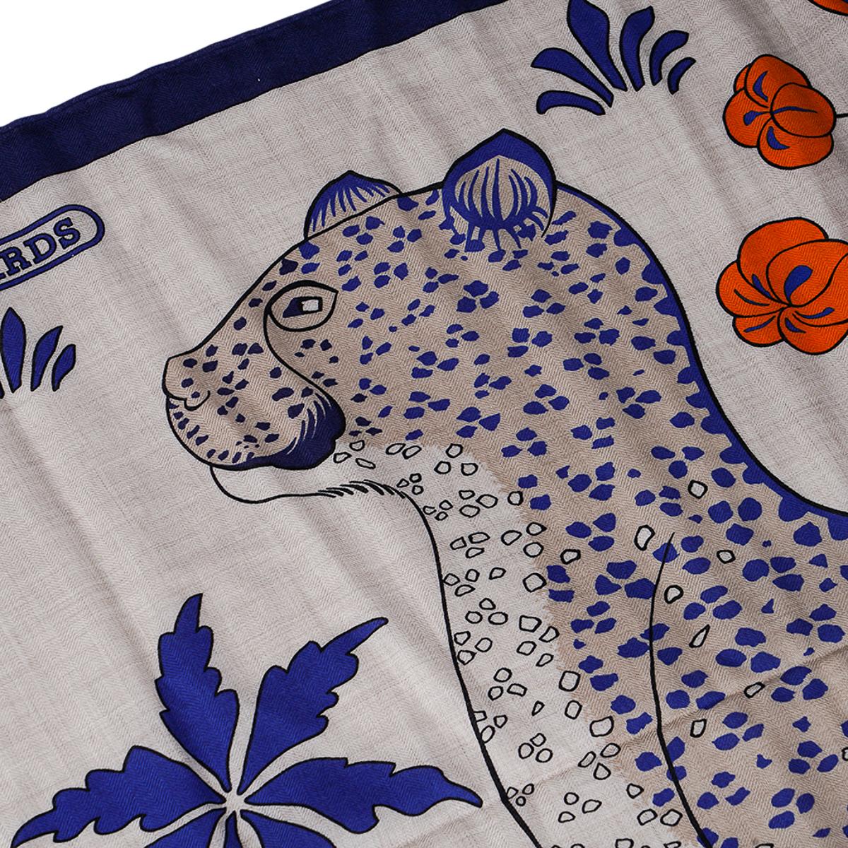 Mightychic offers an  Hermes Les Leopards Cashmere and Silk shawl.
Featured in Naturel, Blue and Orange colorway.
Designed by Christiane Vauzelles.
This beautiful Hermes shawl is perfect for year round wear.
Signature hand rolled edge.
NEW or NEVER