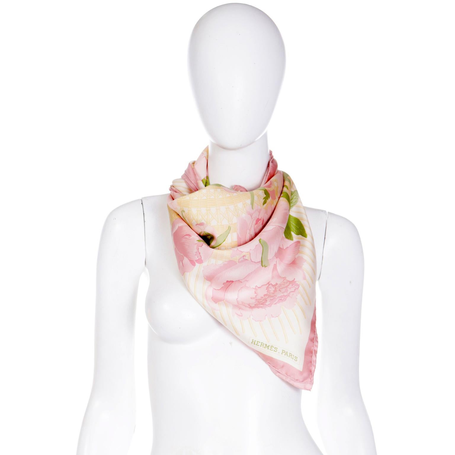 This lovely vintage Hermès scarf is titled Les Pivoines and the design features gorgeous large pink peonies on a pale yellow woven pattern background. Designed by Christiane Vauzelles in 1978, this scarf was released in a variety of colorways and we