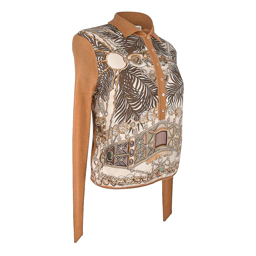 Guaranteed authentic Hermes Les Precieuses scarf print top features beautiful gems in silk and cashmere.  
Silk pullover top with fine ribbed back and sleeves. 
Beautiful intricate design of leaves and jewels in golds, browns, shades of greens and