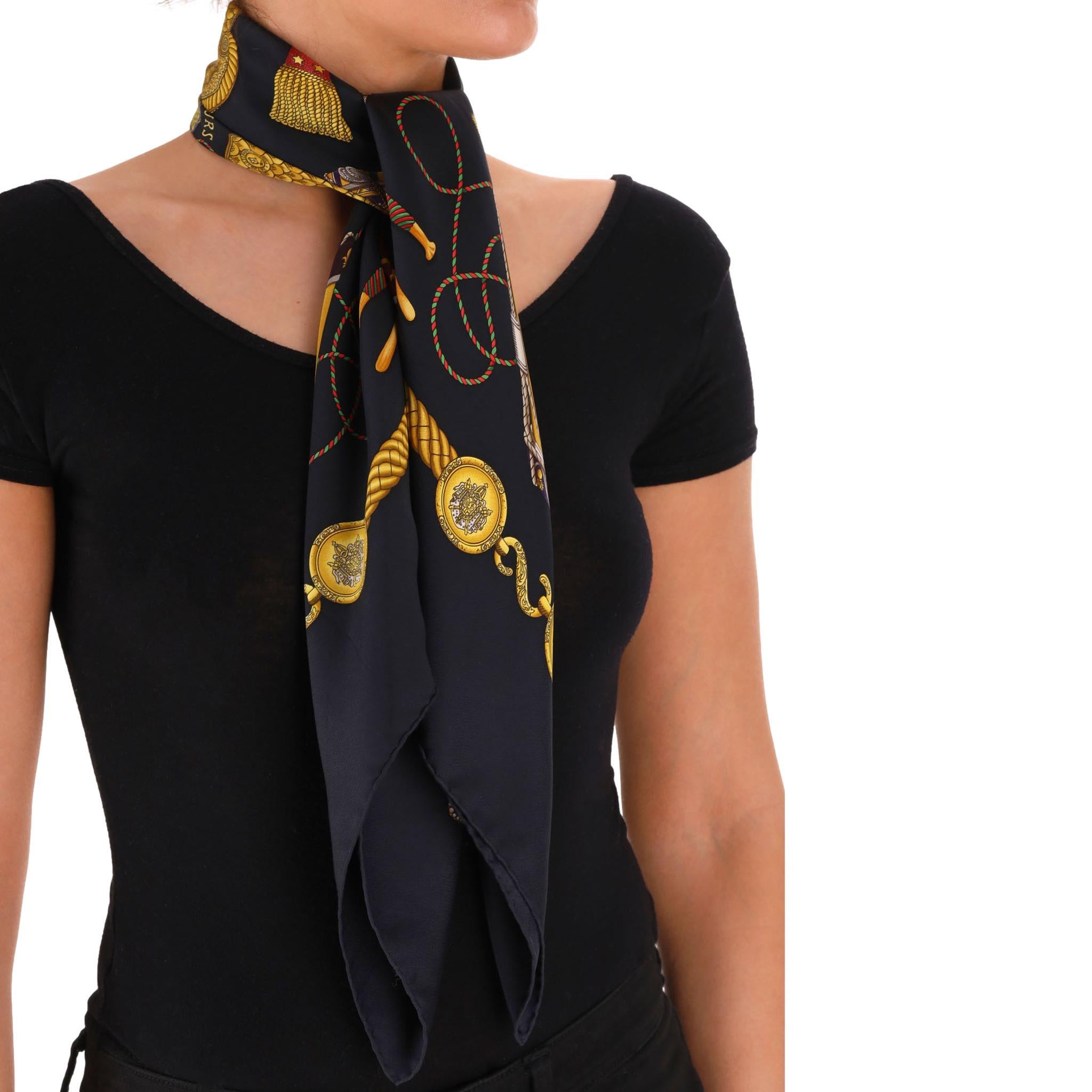 Hermes Les Tambours Carre Silk Scarf 

Black scarf crafted from silk with drums design in gold and violet.

Featuring 'Les Tambours' and 'Hermes-Paris' signatures, hand-rolled edges.

Rrp Approx. £450

Size – 89 x 89cm

Condition – Good/Very Good
