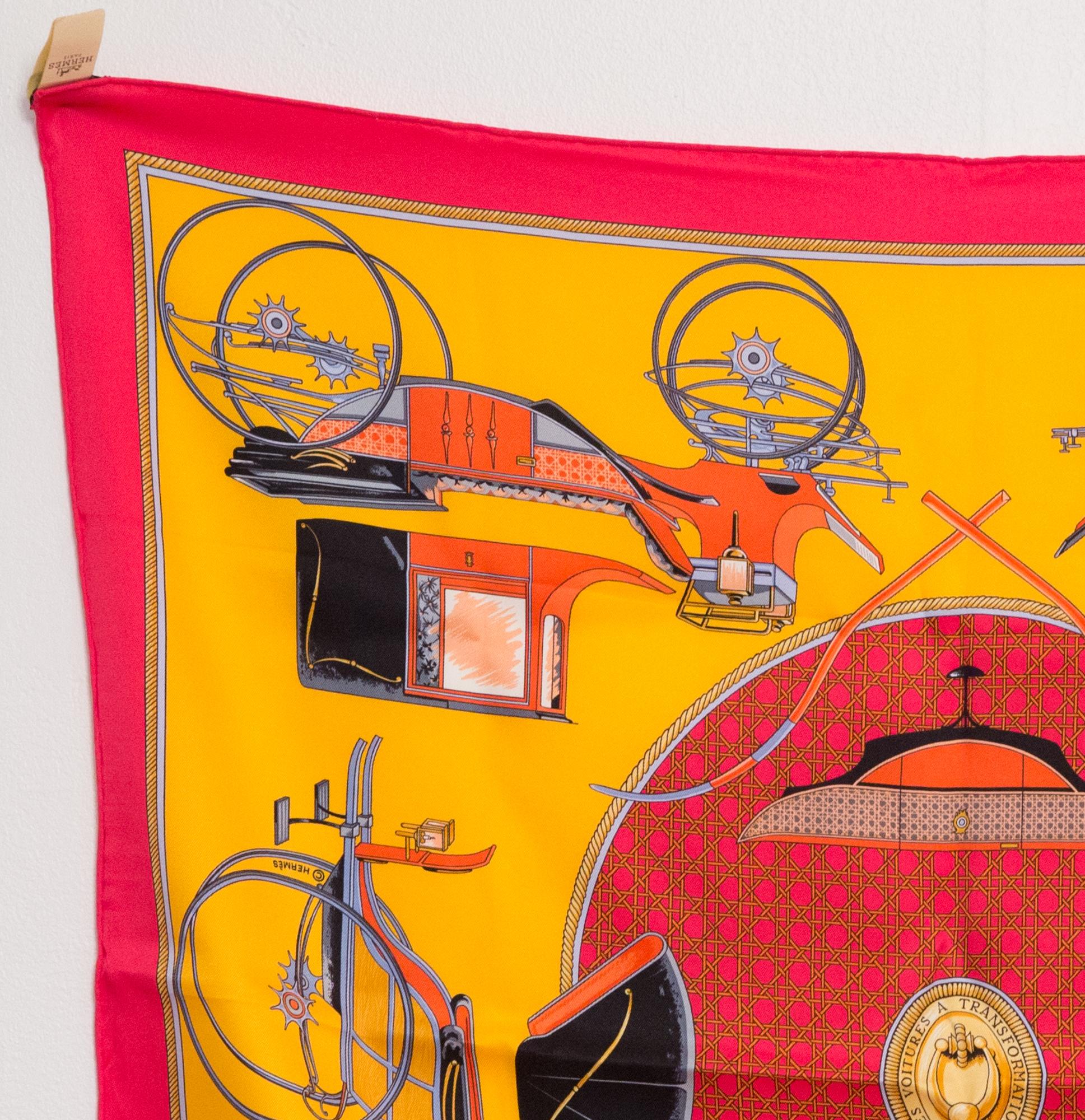 Hermes silk scarf  Les voitures a transformation by Francoise de La Perriere featuring a pink and yellow ground, and a Hermès signature. 
First edition 1965.
In excellent vintage condition.  (as never worn) Made in France.
275 in. (70cm) X 275 in.