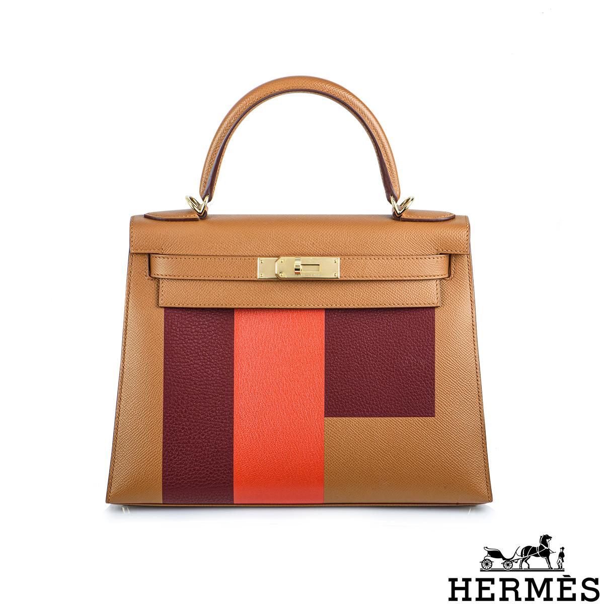 A beautiful Hermès Kelly II Sellier 28cm bag. The exterior of this Letter Kelly features Gold Veau Epsom, Rogue H Clemence, and Capucine Mysore Chevre leather complemented with gold tone hardware and tonal stitching. It features a front toggle