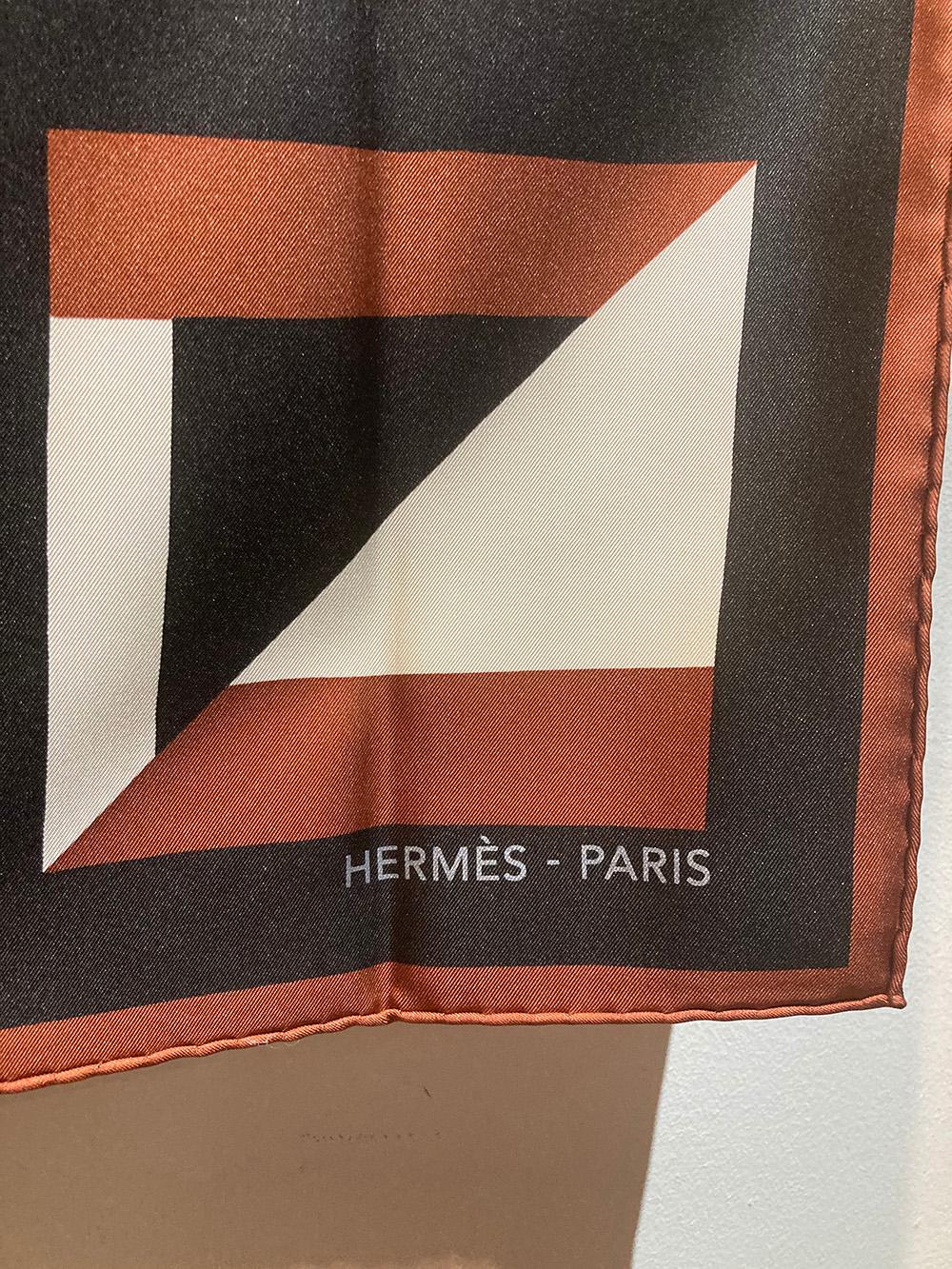 Hermes Lettres au Carre Scarf in brown, cream and black silk in excellent condition. New with tag. No stains smells or fabric pulls. Measurements: 35x35