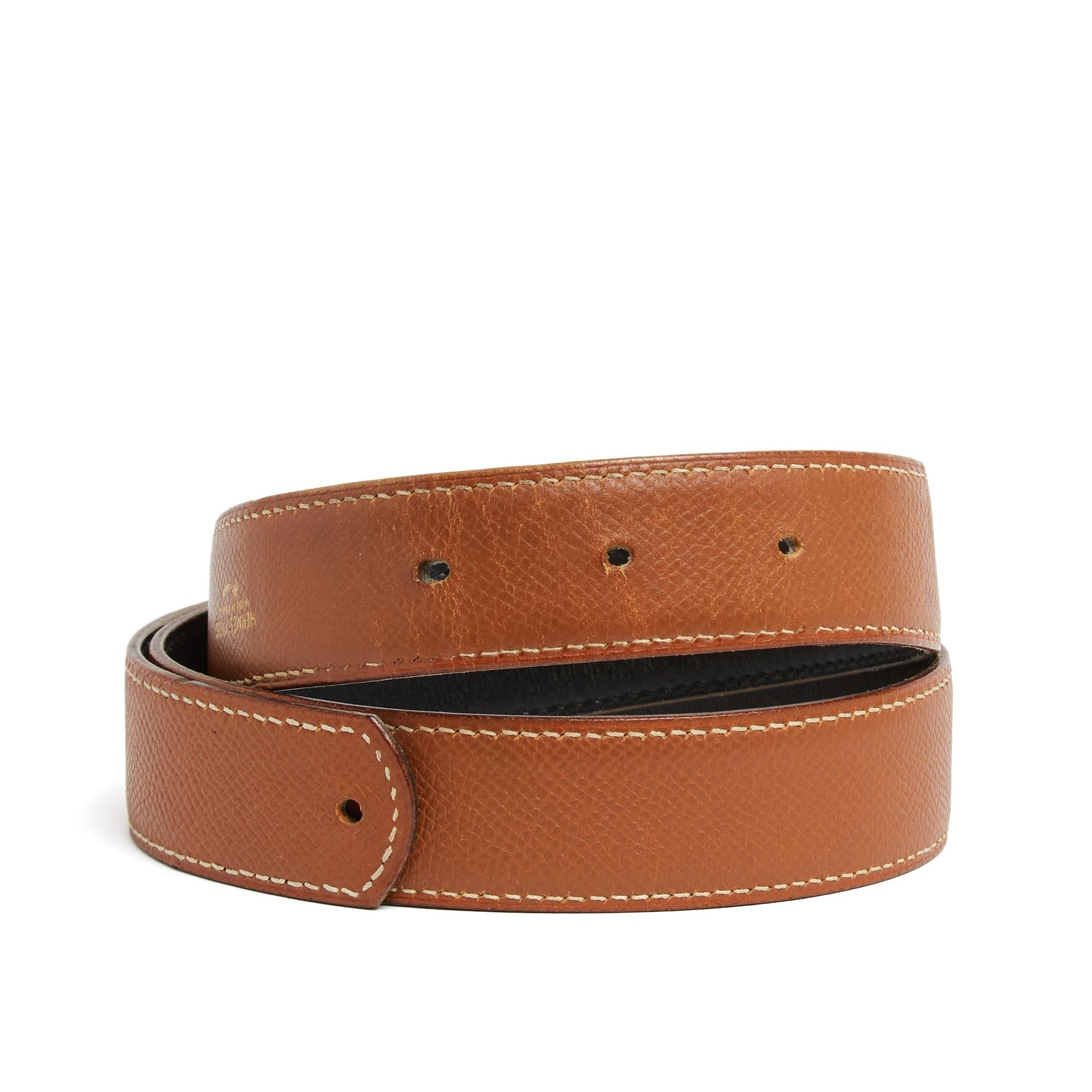 Hermès leather belt strap. Reversible in gold grained leather on one side and smooth black 