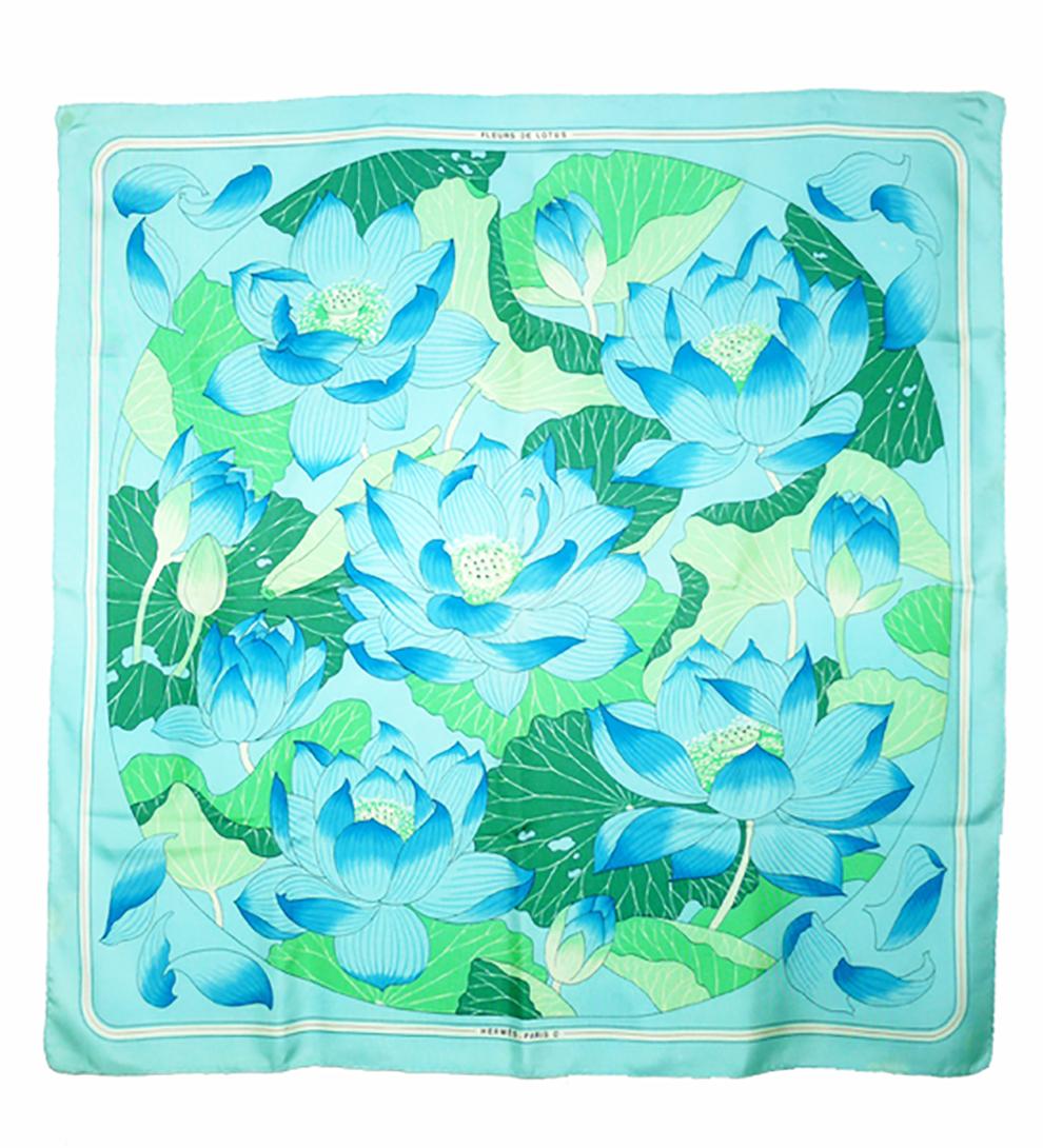 Hermes silk scarf Fleurs de Lotus by Christiane Vauzelle featuring light blue, turquoise lotus floral scene.
Circa 1985
In good vintage condition. Made in France.
35,4in. (90cm)  X 35,4in. (90cm)
We guarantee you will receive this  iconic item as