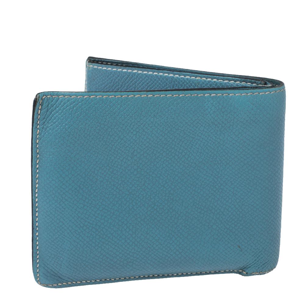 Showcasing an exclusive design from Hermes, this wallet makes for a convenient accessory. A rich leather construction is the characteristic feature of this wallet. Characterized by a chic blue shade, it can fit in your cash and cards with