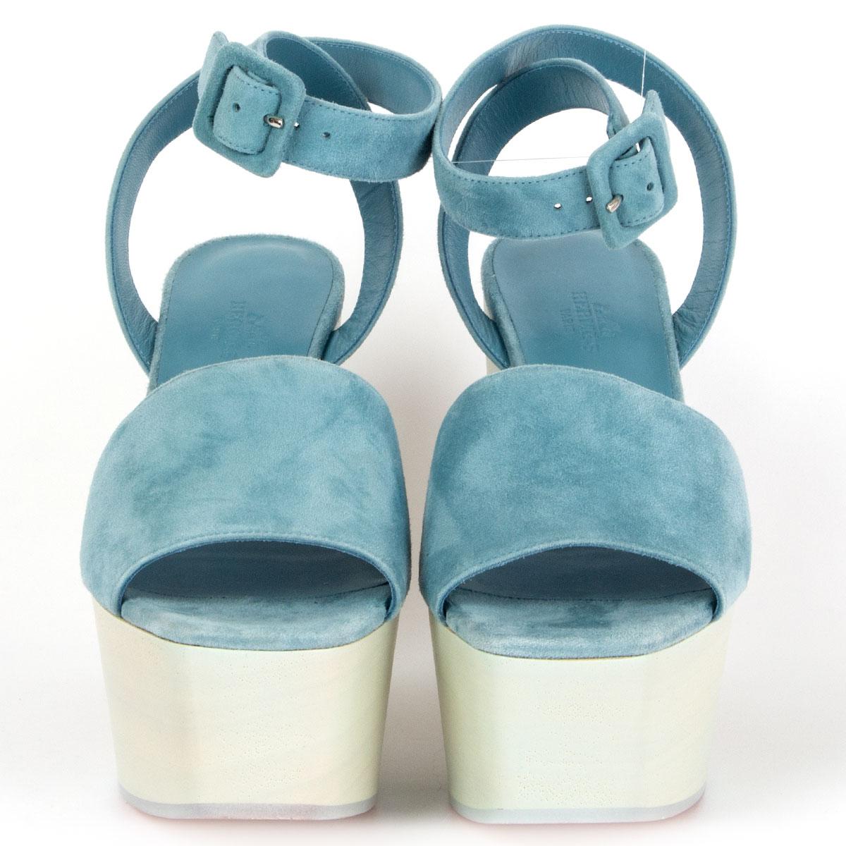 100% authentic Hermès Tendress ankle-strap wedge platform sandals in sky blue suede goatskin with hollow wooden wedge heel with cut-out cloud motif. Close with a suede goatskin buckle on the side. Brand new. Come with dust bag. 

Imprinted