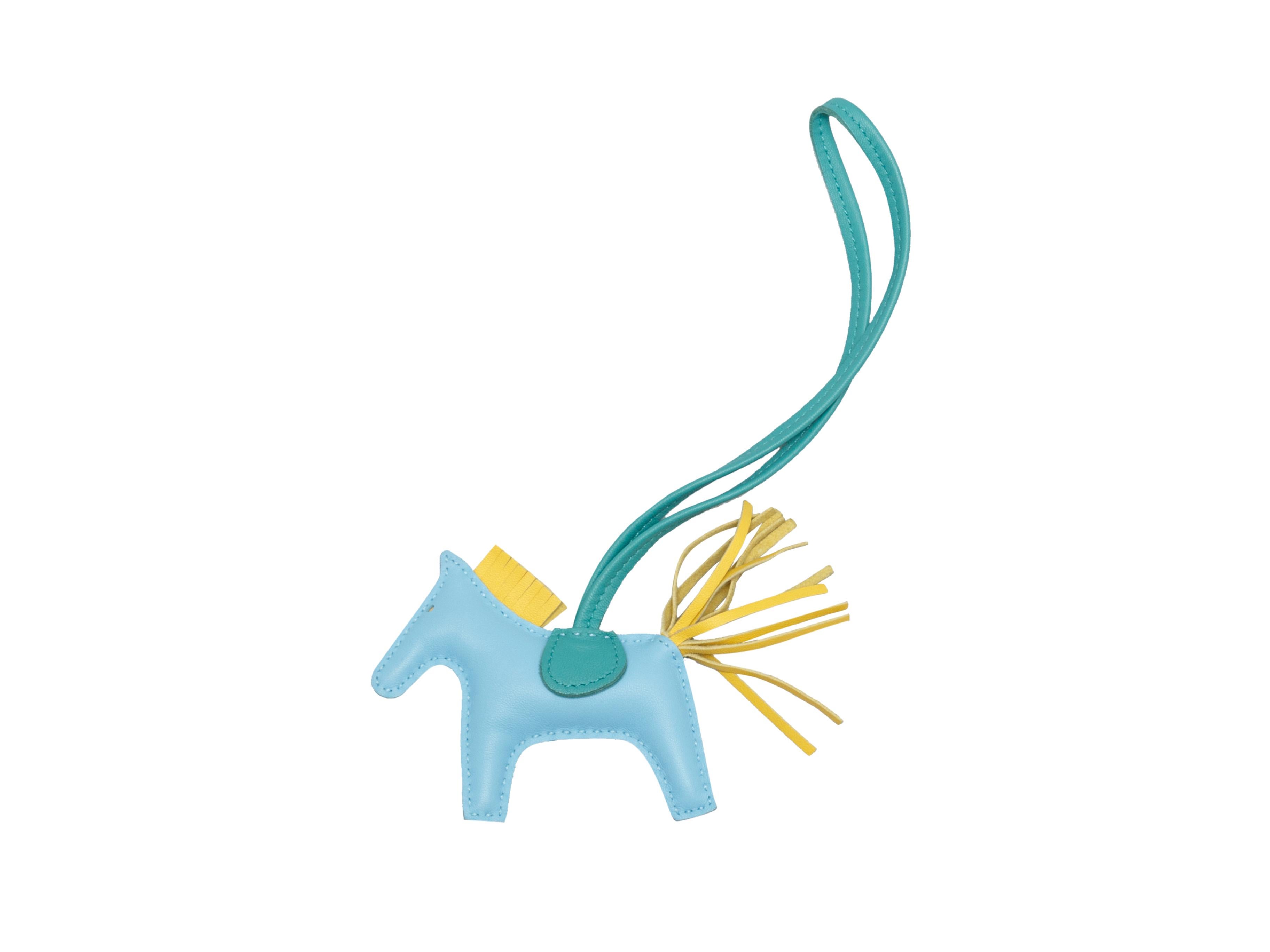 Product details: Light blue, yellow and teal leather horse keychain by Hermes. Tonal stitching throughout. 9.25