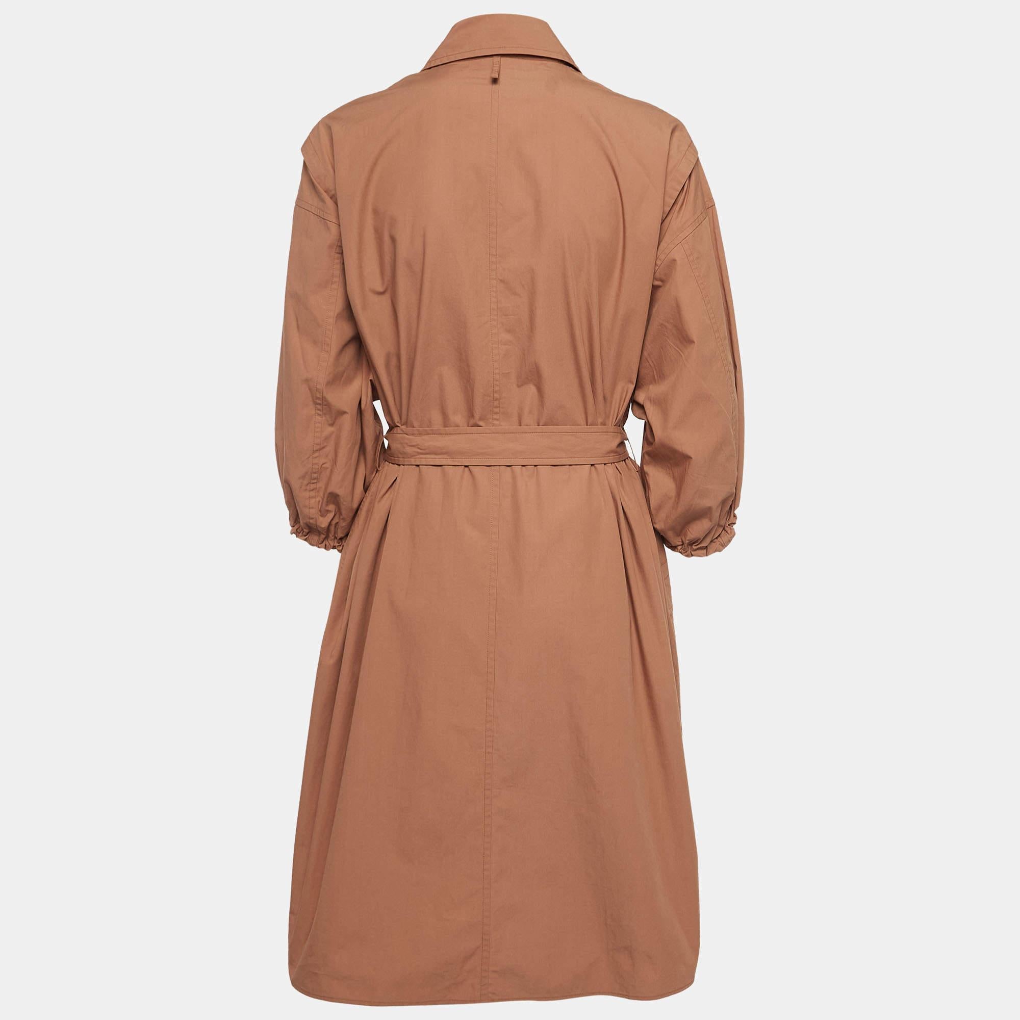 Discover the epitome of elegance with the Hermès dress. Crafted with exquisite attention to detail, this dress embodies refined simplicity. The light brown hue exudes warmth, while the belted waist accentuates your silhouette with grace. Elevate