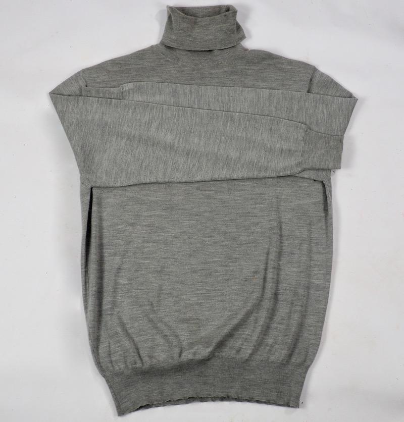 Classic and elegant fine cashmere and silk light grey roll neck sweater.