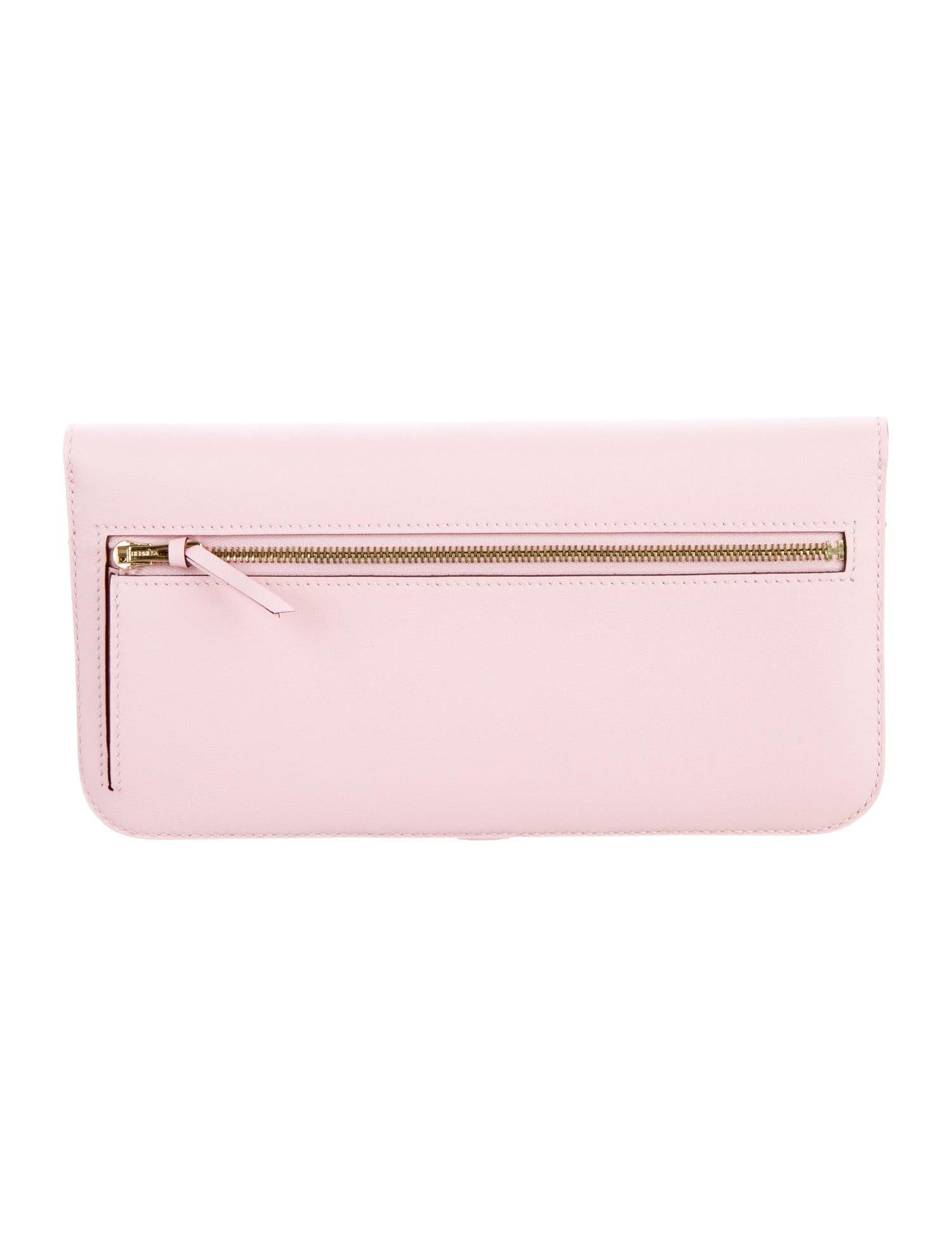 Hermes Light Pink Leather Gold Envelope Evening Clutch Wallet in Box

Leather 
Gold-plated hardware
Leather lining
Belted turnlock closure
Features twelve card slots 
Measures 8