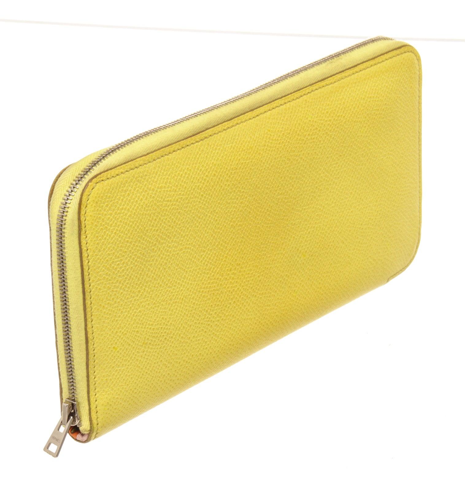 Hermes Lime Epsom Leather Silk'In Wallet with palladium-plated hardware, multicolor Les Sangles motif silk lining, three interior compartments; one with zip closure, dual interior bill compartments, 12 card slots and zip-around closure.
42595MSC