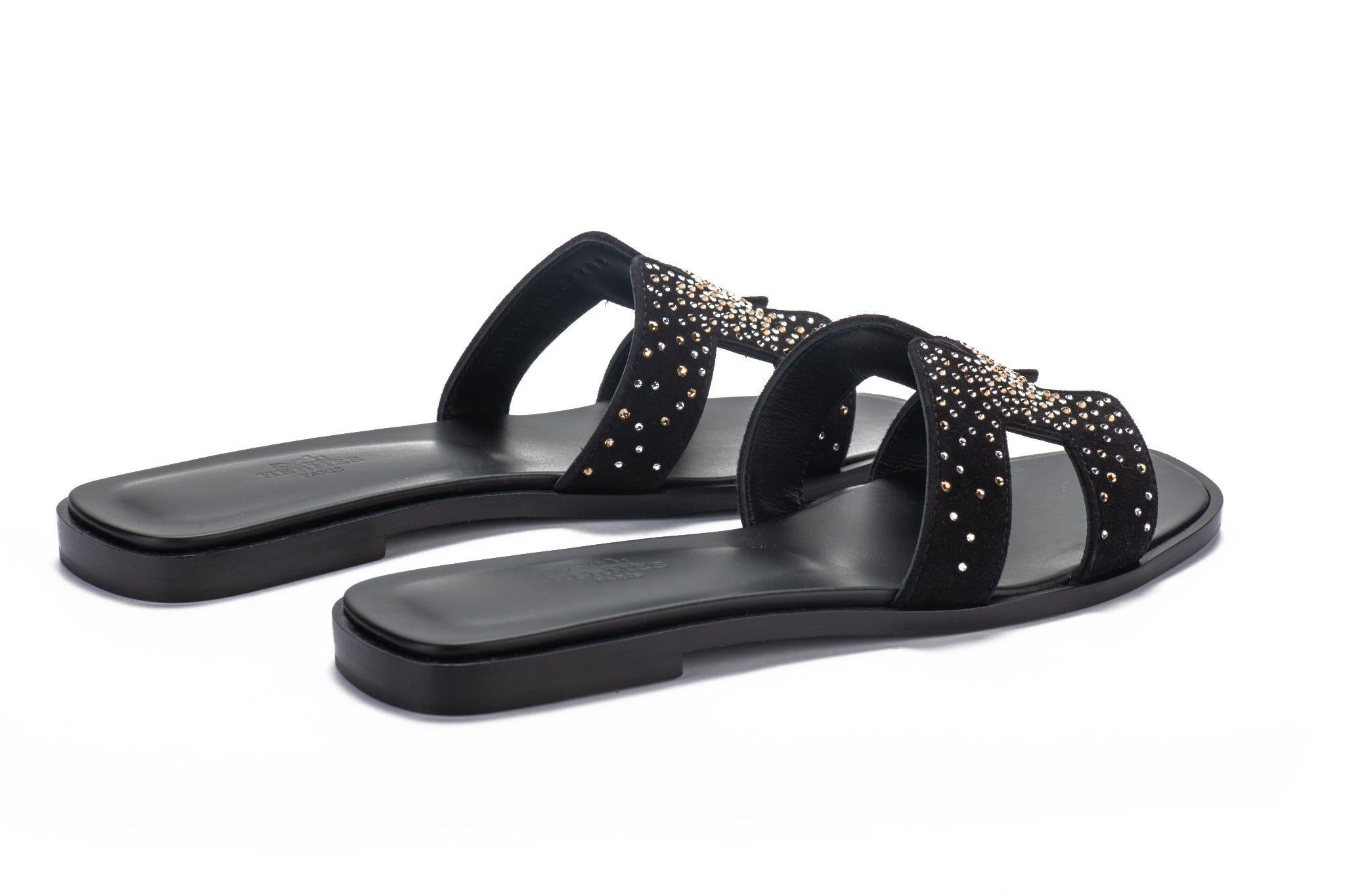 Hermes limited edition black goatskin suede flat sandals with rhinestones H design. Size European N. 38, come with dust cover and original box. Brand new.