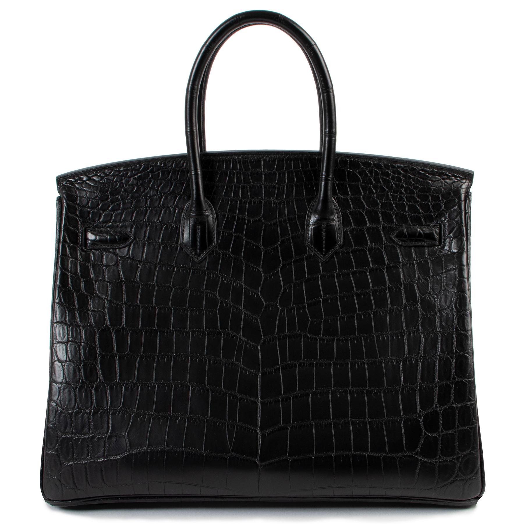 Hermes *LIMITED* Birkin 35 So Black Matte Niloticus Crocodile

HURRY HURRY !!! Get your hands on this stunning very rare Hermes Birkin So Black.  It is one of the rarest and most desirable Birkin bags.  Crafted in matte black niloticus crocodile, as