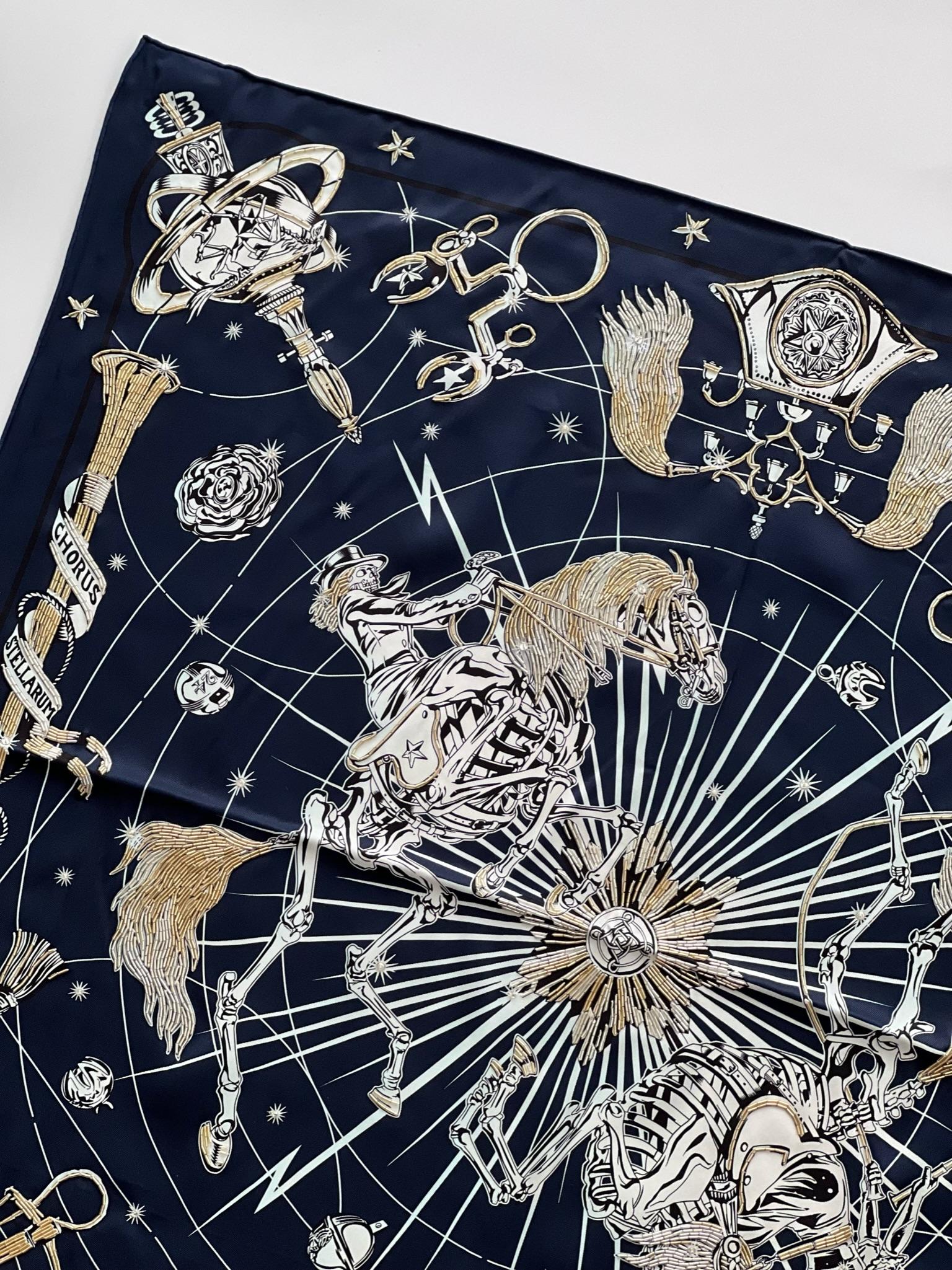 This limited scarf from Hermes is titled the Chorus Stellarum, a celebration of the equestrian universe. The stars surround embroidered equestrian accessories. The scarf is made from with silver detailing. The scarf takes over 35 hours of hand