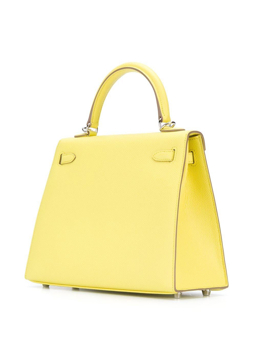 In a highly sought-after compact size, this Hermès Candy Kelly 25 bag makes an irresistibly feminine statement. Expertly crafted in France from a supple lime green epsom leather, hand stitched by skilled craftsmen in a contrasting white and