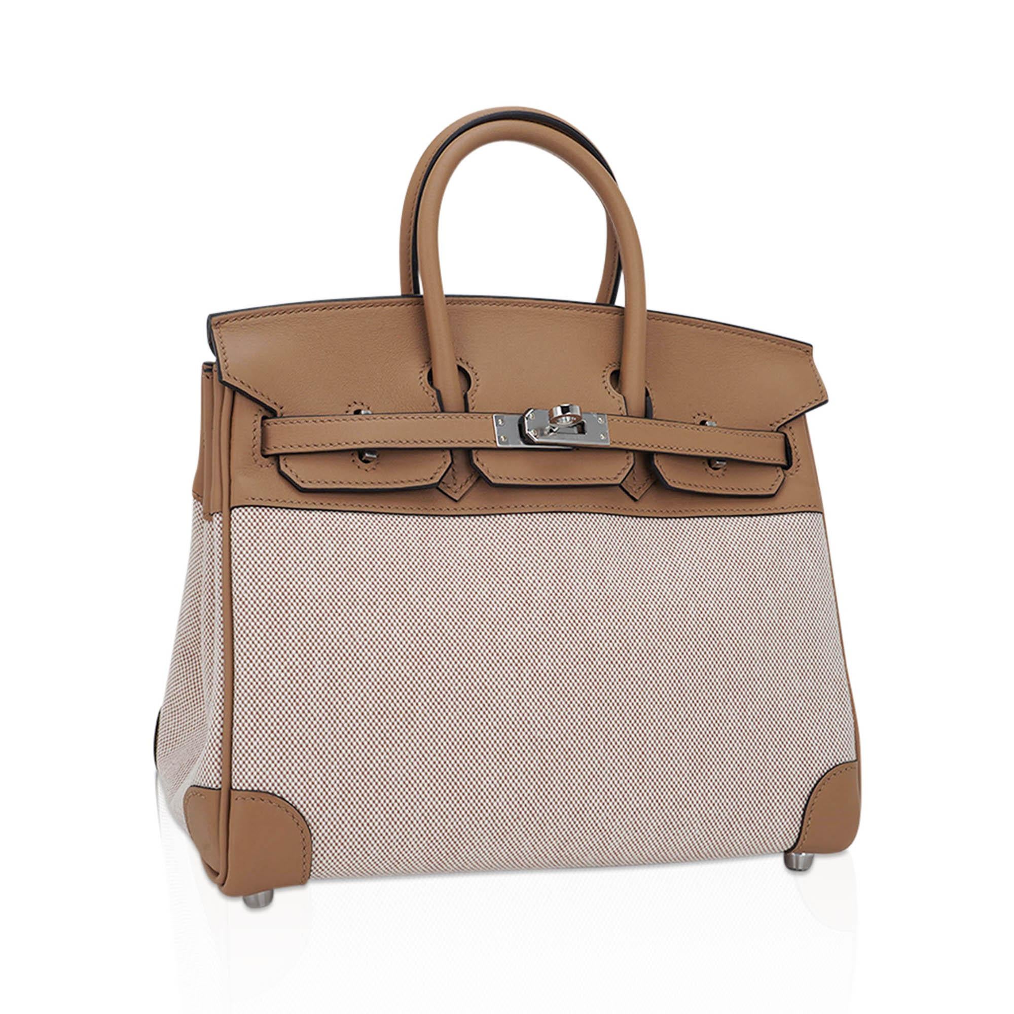Mightychic offers a limited edition Hermes Birkin 25 bag featured in coveted Toile H in beige and ecru with Chai Swift leather.
This prized Toile Birkin in a 25 is virtually impossible to find, and true collectors treasure.
Rich neutral Hermes